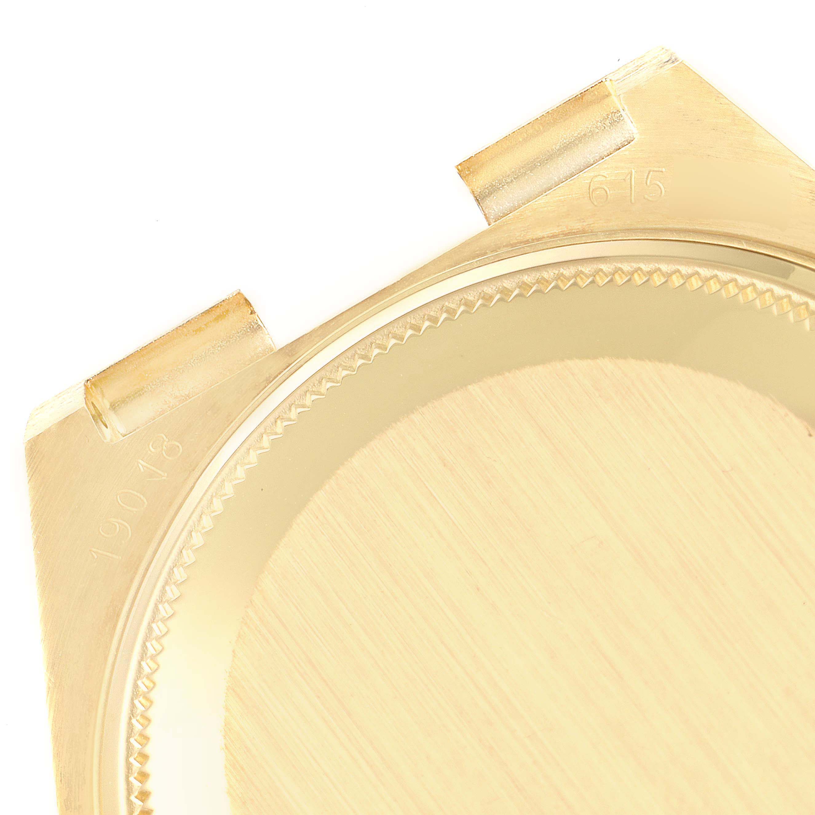 This is a close-up of the back case cover of a Rolex Oysterquartz 19018 Men's Yellow Gold Champagne Dial 19018 Men's Yellow Gold Champagne Dial watch, showing the model number and part details.