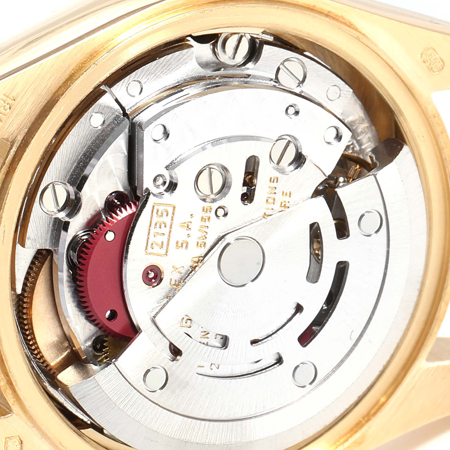 This image shows the intricate internal mechanism of a Rolex President 69178 Women's Yellow Gold Black Dial 69178 Women's Yellow Gold Black Dial model watch, viewed from a close-up angle.