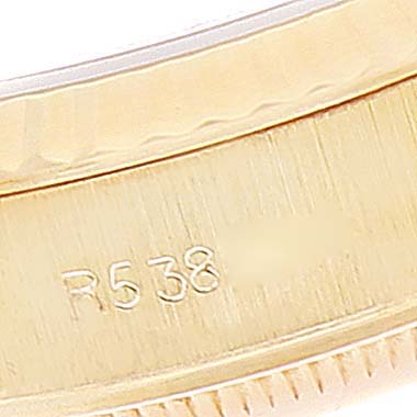 This close-up image shows the inner part of the bezel of the Rolex President 69178 Women's Yellow Gold Champagne Dial 69178 Women's Yellow Gold Champagne Dial model, displaying the serial number "R538."