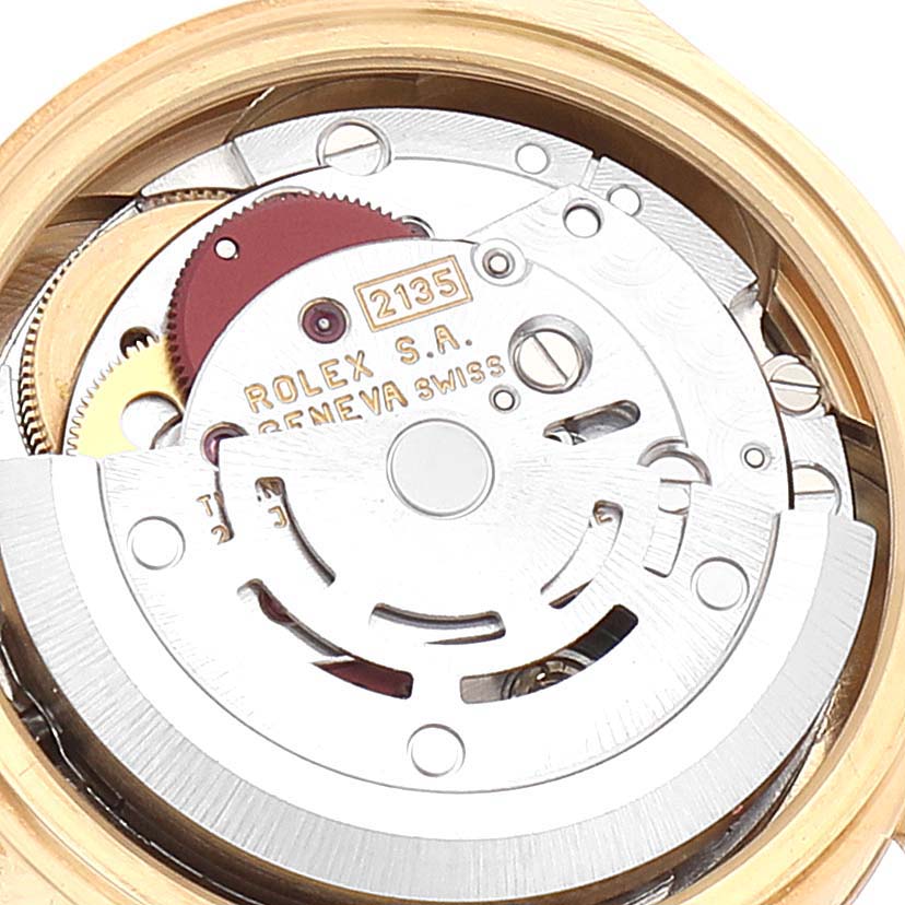 The image shows a close-up view of the movement mechanism of a Rolex President 69178 Women
s Yellow Gold Champagne Dial 69178 Women
s Yellow Gold Champagne Dial model watch.