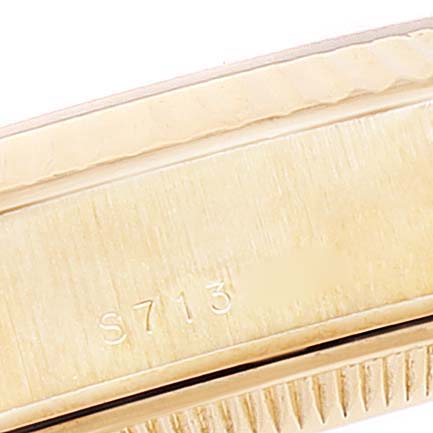 This image shows a close-up of the case side of a Rolex President 69178 Women
s Yellow Gold Champagne Dial 69178 Women
s Yellow Gold Champagne Dial model watch, focusing on the serial number.