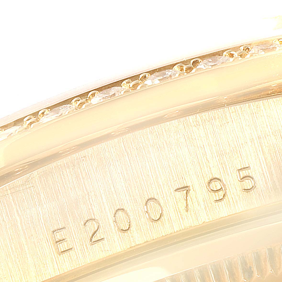This image shows a close-up angle of the serial number engraved on the side of a Rolex President 18348 Men's Yellow Gold Champagne Dial 18348 Men's Yellow Gold Champagne Dial model watch.