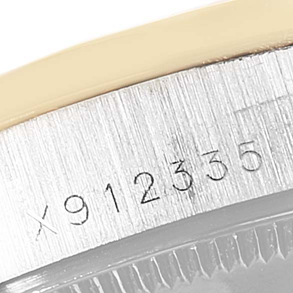 This close-up image shows the serial number etched on the side of the Rolex President 68289 Women's White Gold Brown Dial 68289 Women's White Gold Brown Dial watch case.