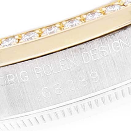 The image shows a close-up of the bezel with diamonds and the engraved side of the case of a Rolex President 68289 Women's White Gold Brown Dial 68289 Women's White Gold Brown Dial model.