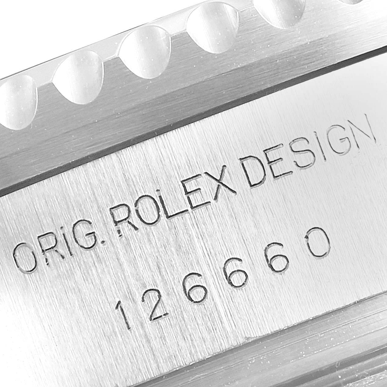 This close-up image shows the engraved model number and design inscription on the side of a Rolex Sea-Dweller 126660 Men
s Stainless Steel Blue Dial 126660 Men
s Stainless Steel Blue Dial watch.