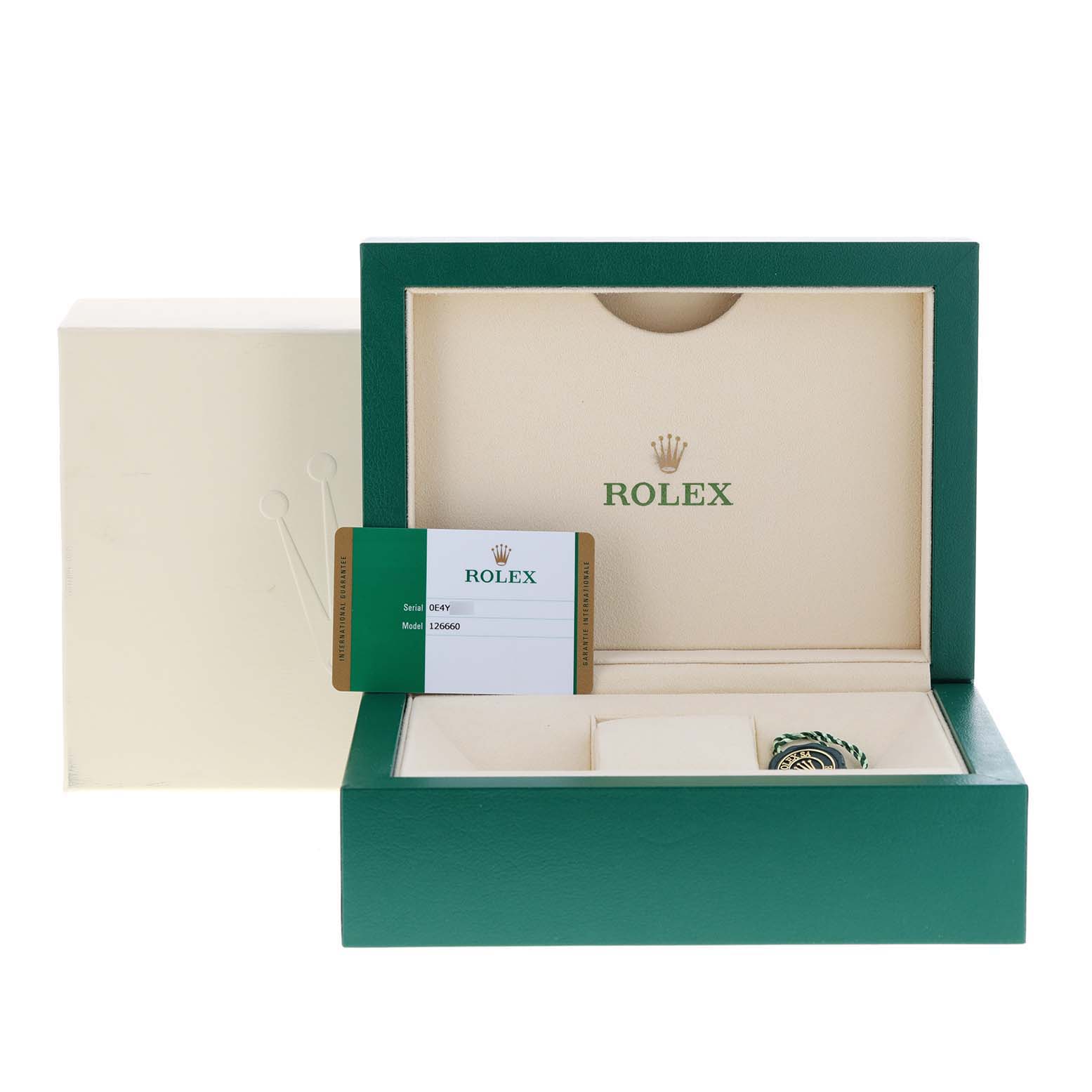 The image shows the open box and packaging for the Rolex Sea-Dweller 126660 Men
s Stainless Steel Blue Dial 126660 Men
s Stainless Steel Blue Dial model, along with its warranty card.
