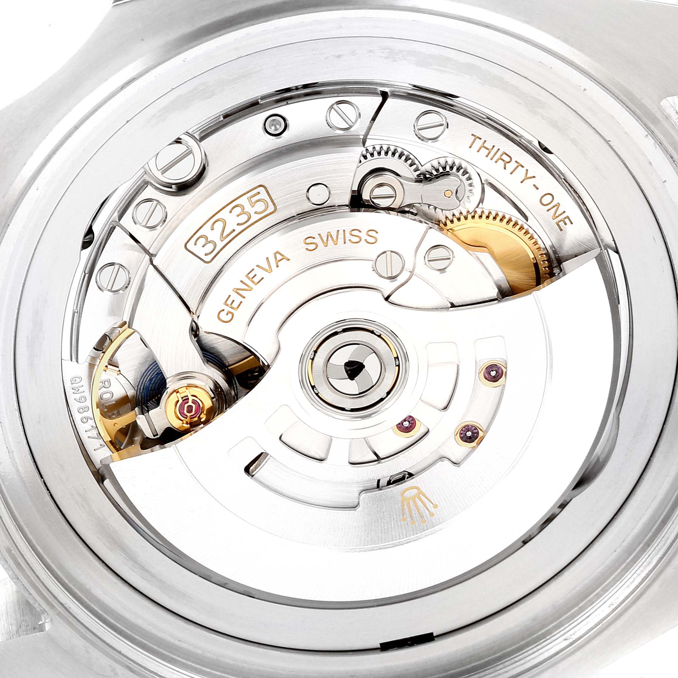 The image shows a close-up of the movement mechanism of a Rolex Sea-Dweller 126660 Men's Stainless Steel Blue Dial 126660 Men's Stainless Steel Blue Dial watch with the rotor, gears, and inscriptions visible.