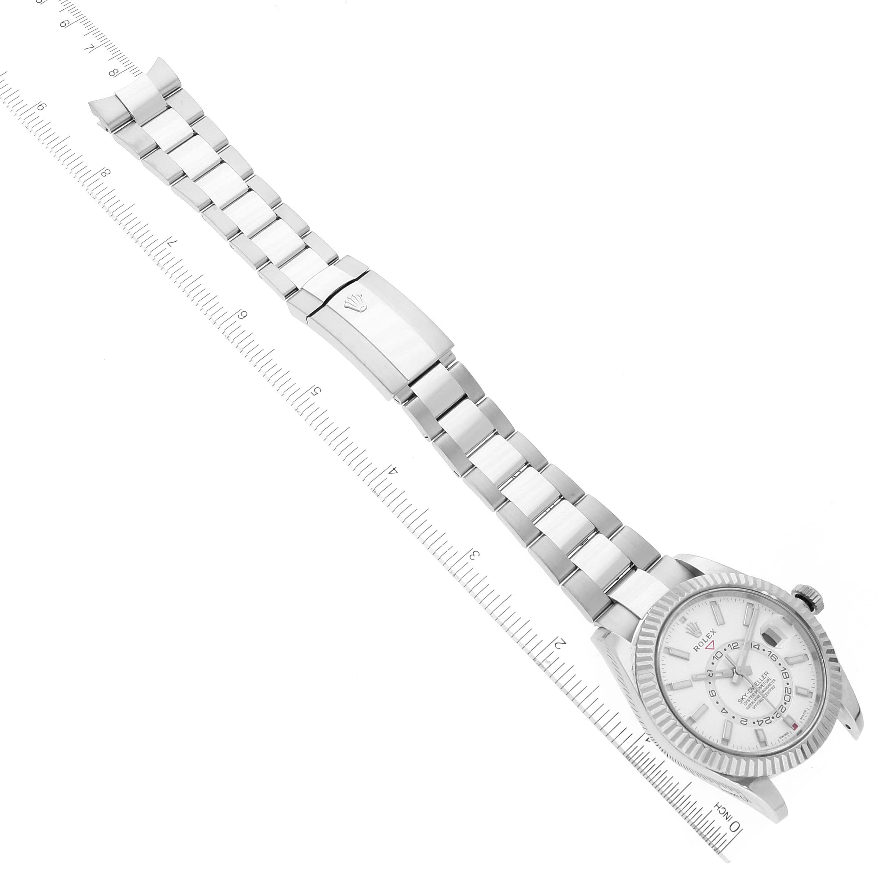 The Rolex Sky-Dweller 326934 Men's Stainless Steel White Dial 326934 Men's Stainless Steel White Dial watch is shown from a top-down angle, displaying the face, bezel, and full metal bracelet.