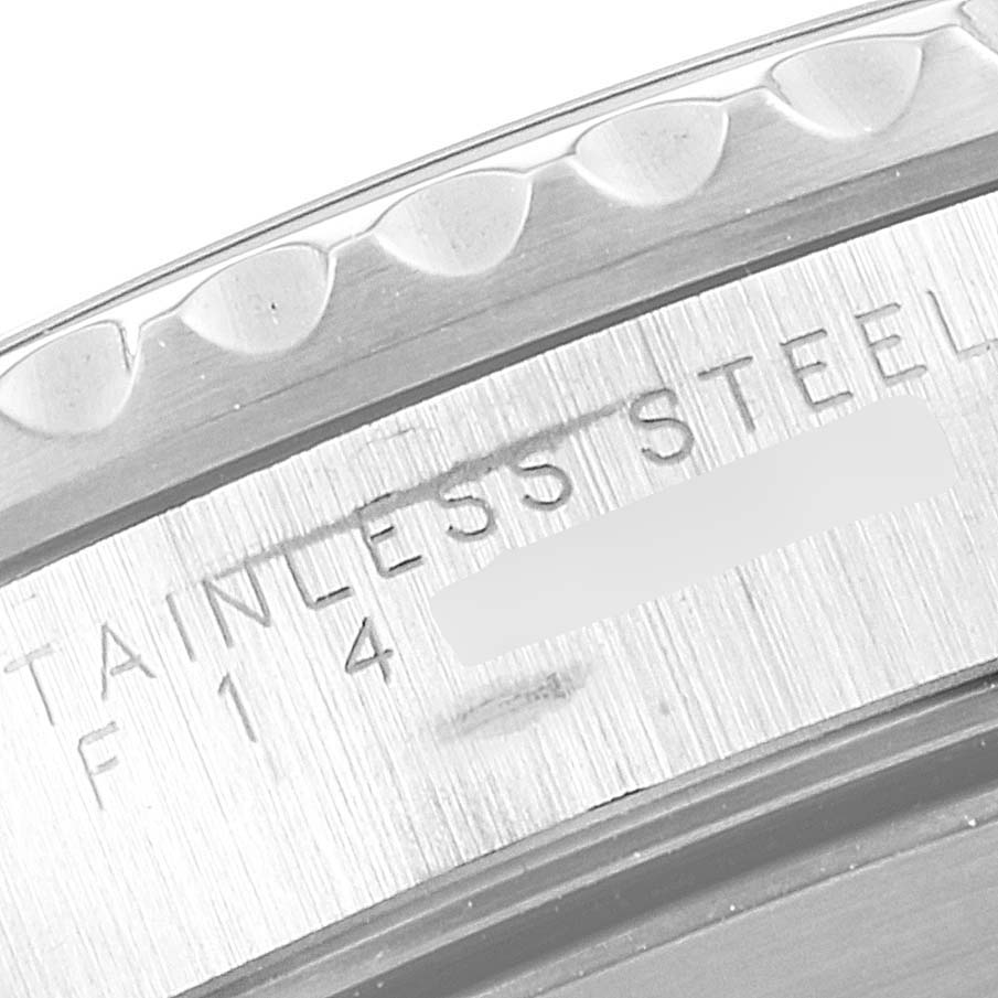 This image shows a close-up view of the bezel and engraved side of a Rolex Submariner 14060 Men
s Stainless Steel Black Dial 14060 Men
s Stainless Steel Black Dial watch, highlighting the "Stainless Steel" inscription.
