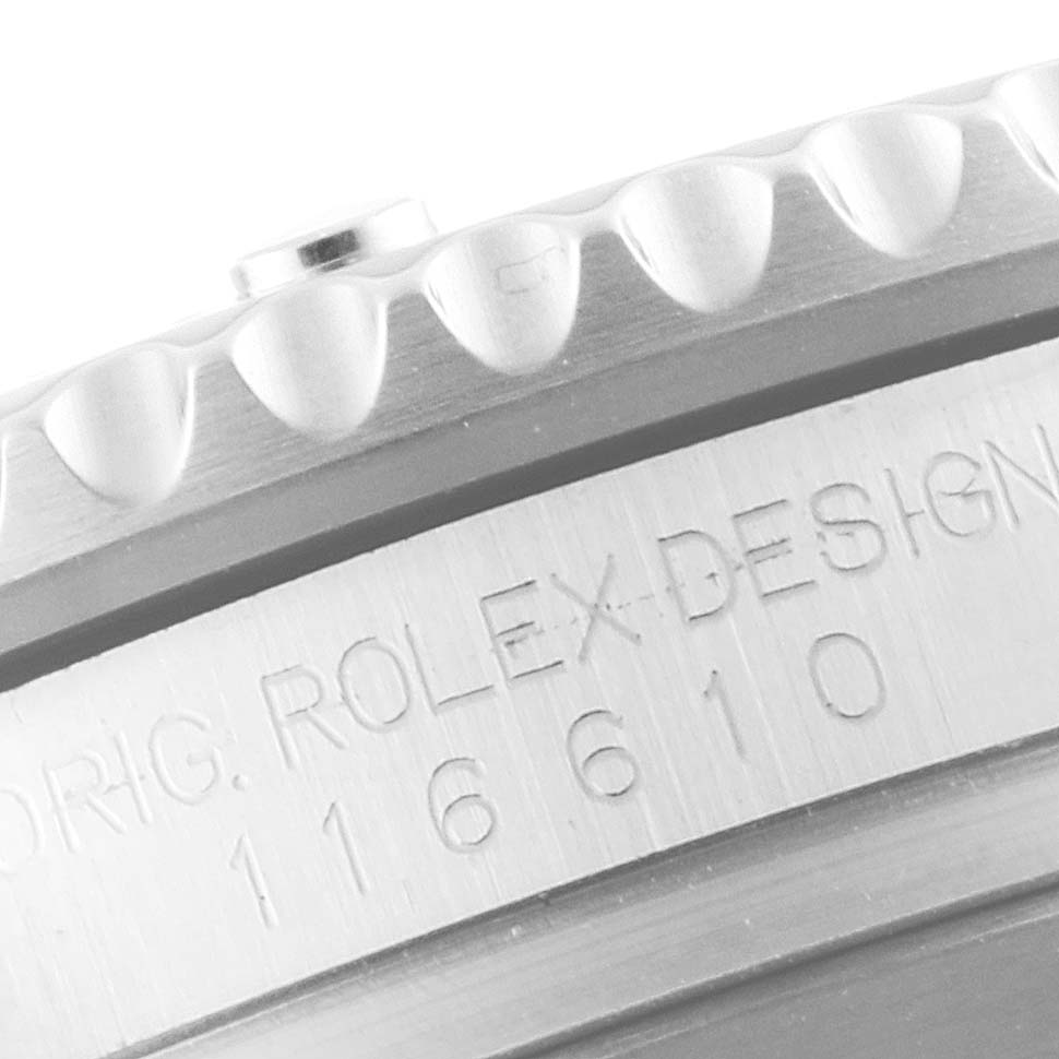 This image shows a close-up of the bezel and engraved case serial number of a Rolex Submariner 116610LN Men
s Stainless Steel Black Dial 116610LN Men
s Stainless Steel Black Dial watch.