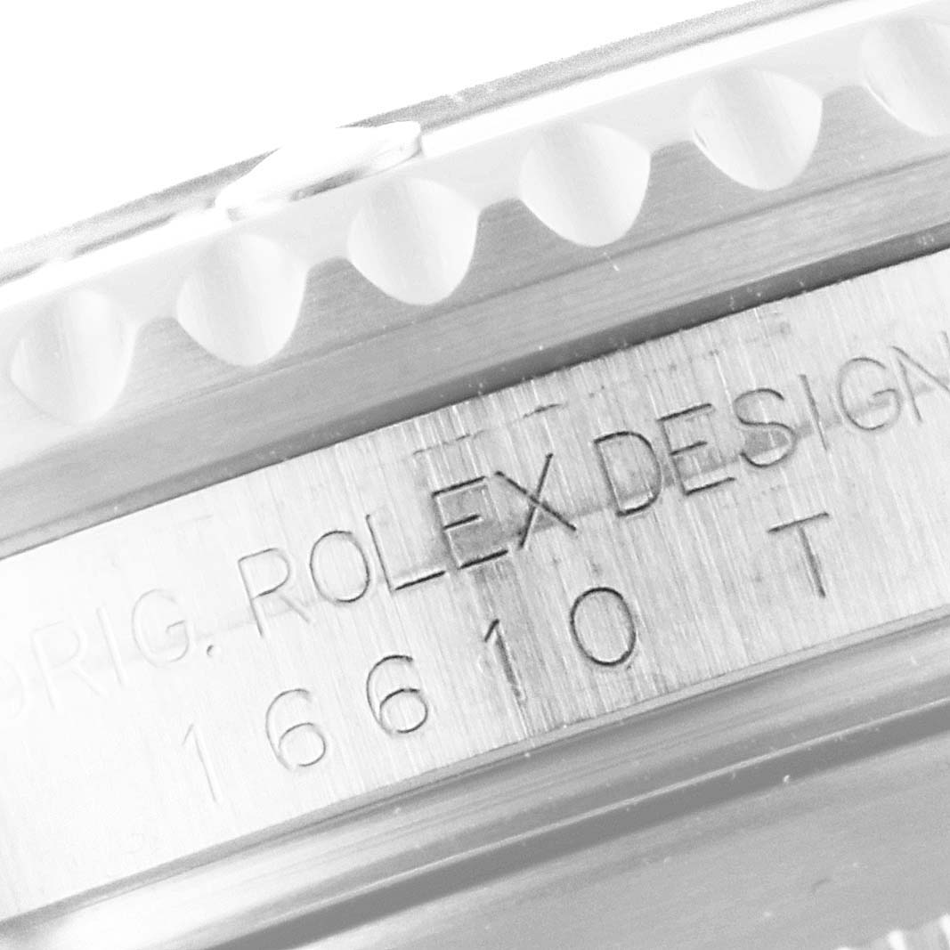 Close-up of the side of a Rolex Submariner 16610 Men
s Stainless Steel Black Dial 16610 Men
s Stainless Steel Black Dial, showing the model number "16610" and "ROLEX DESIGN" engraving.