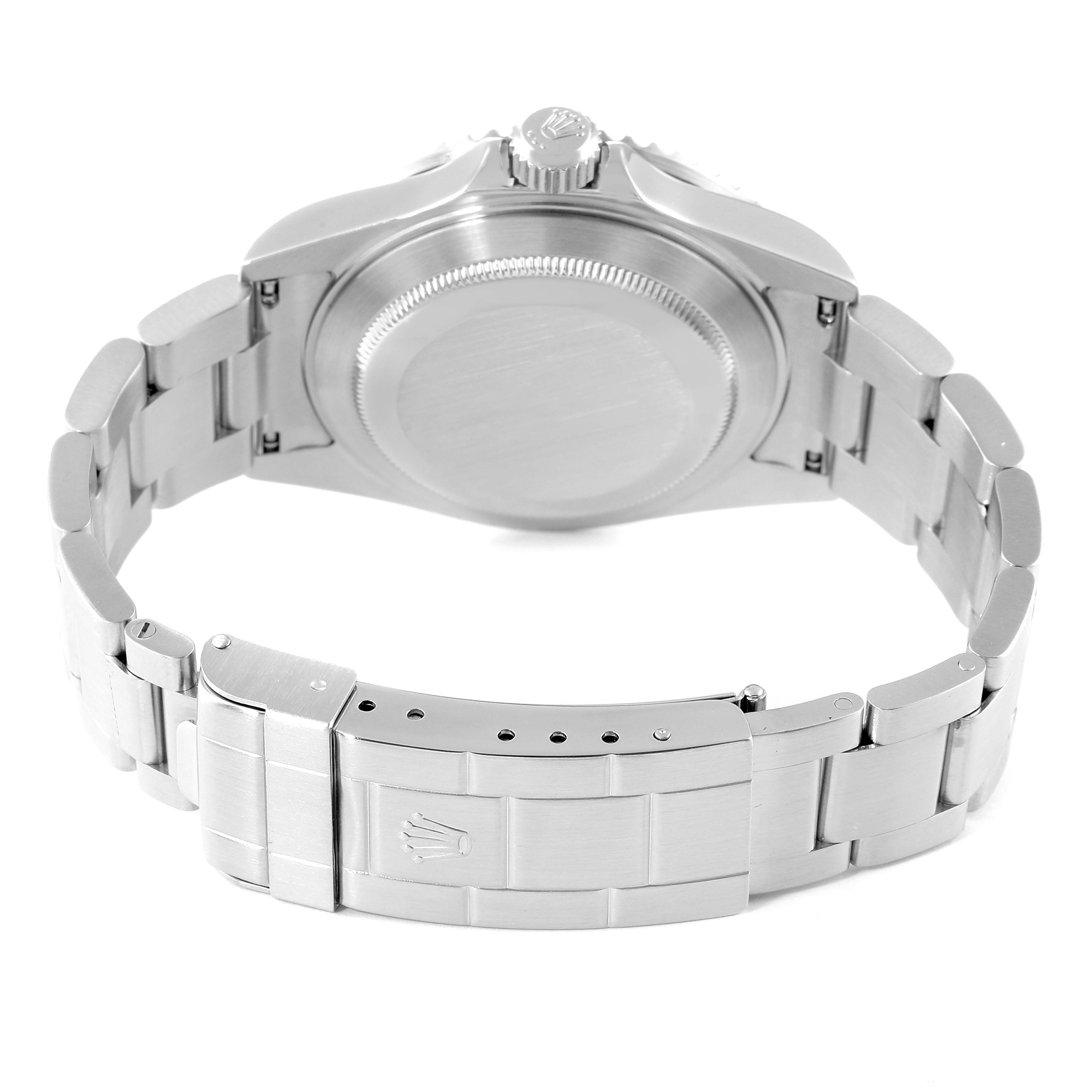 The image shows the back view of a Rolex Submariner 16610 Men
s Stainless Steel Black Dial 16610 Men
s Stainless Steel Black Dial watch, highlighting the case back and bracelet clasp.