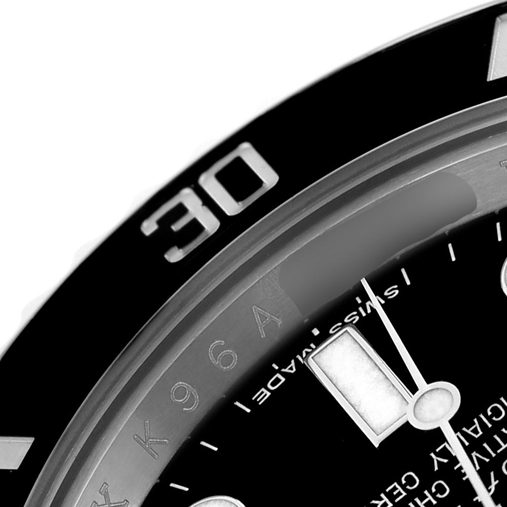 The image shows a close-up of the dial and bezel of a Rolex Submariner 116610 Men's Stainless Steel Black Dial 116610 Men's Stainless Steel Black Dial, highlighting the 30 mark and part of the minute hand.