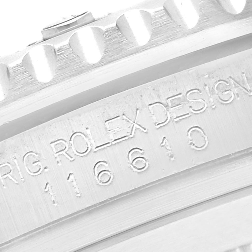 The image shows a close-up of the serial engravings and bezel edge on a Rolex Submariner 116610 Men's Stainless Steel Black Dial 116610 Men's Stainless Steel Black Dial watch.