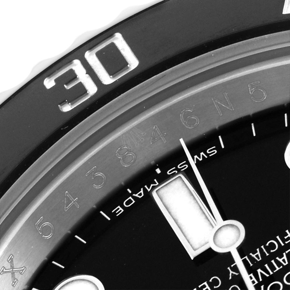 The image shows a close-up of the bezel and part of the dial of a Rolex Submariner 116610 Men's Stainless Steel Black Dial 116610 Men's Stainless Steel Black Dial.