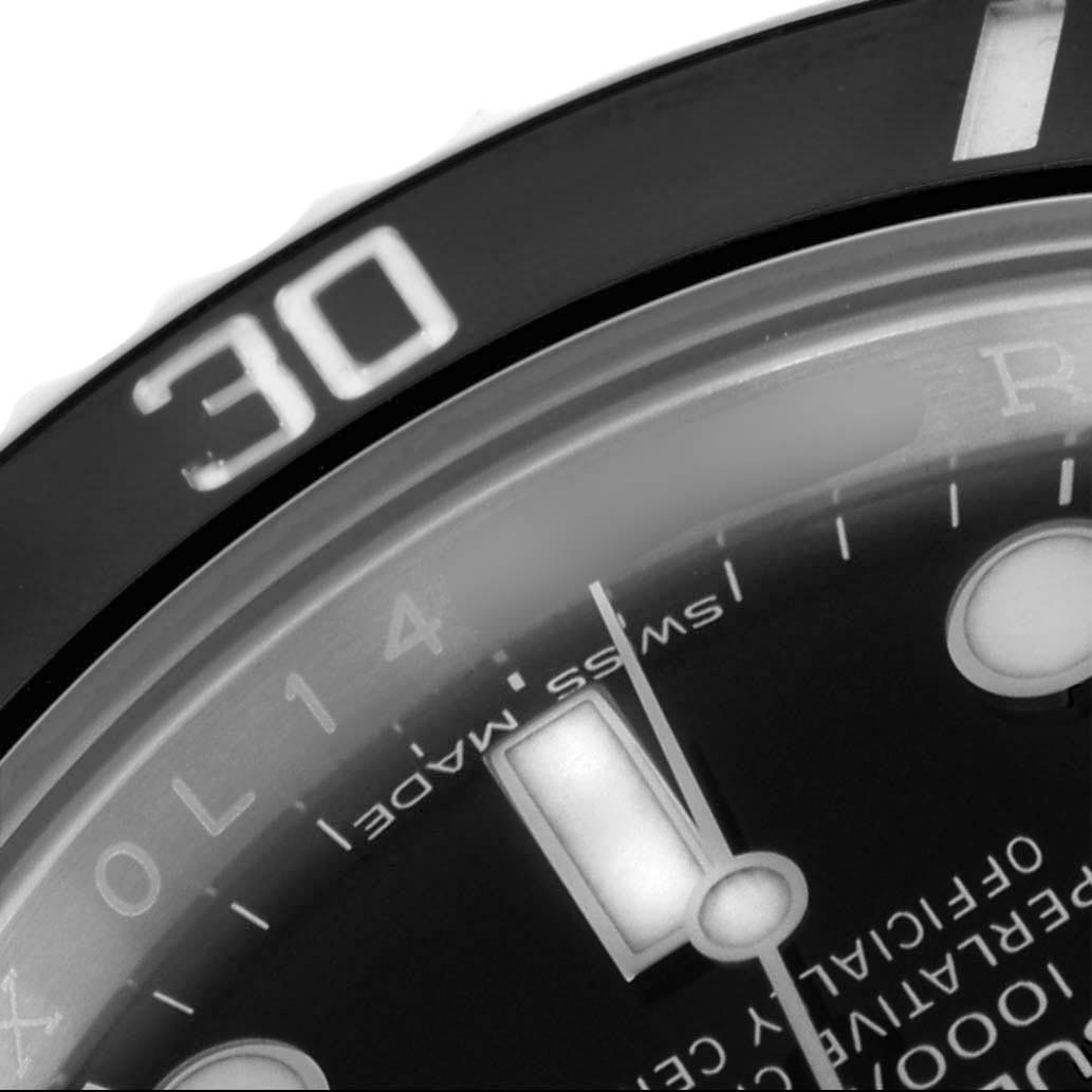 The image shows a close-up of the bezel and dial of a Rolex Submariner 116610 Men's Stainless Steel Black Dial 116610 Men's Stainless Steel Black Dial, featuring part of the minute markings and the “Swiss Made” text.
