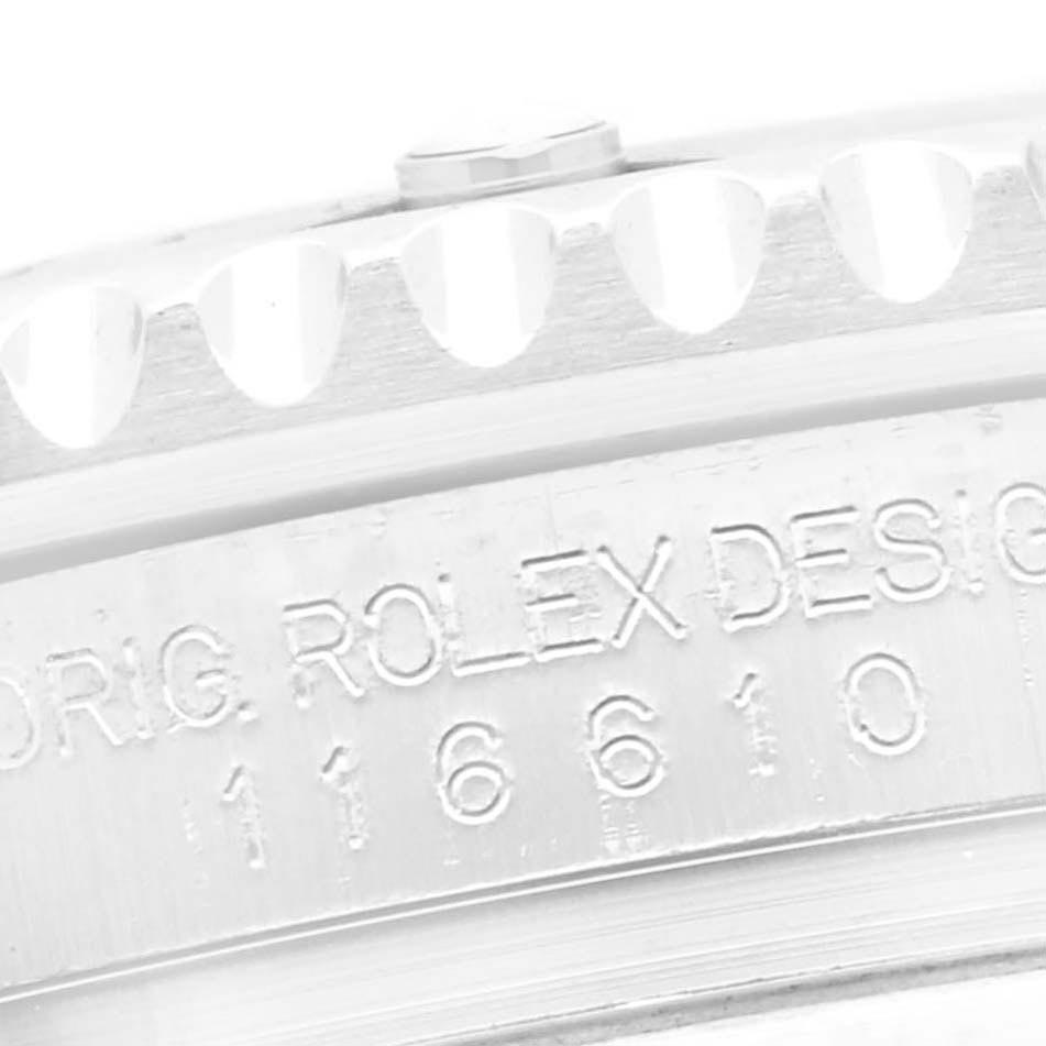 The image shows a close-up of the bezel and engraved side of a Rolex Submariner 116610 Men's Stainless Steel Black Dial 116610 Men's Stainless Steel Black Dial watch, highlighting the serial number.