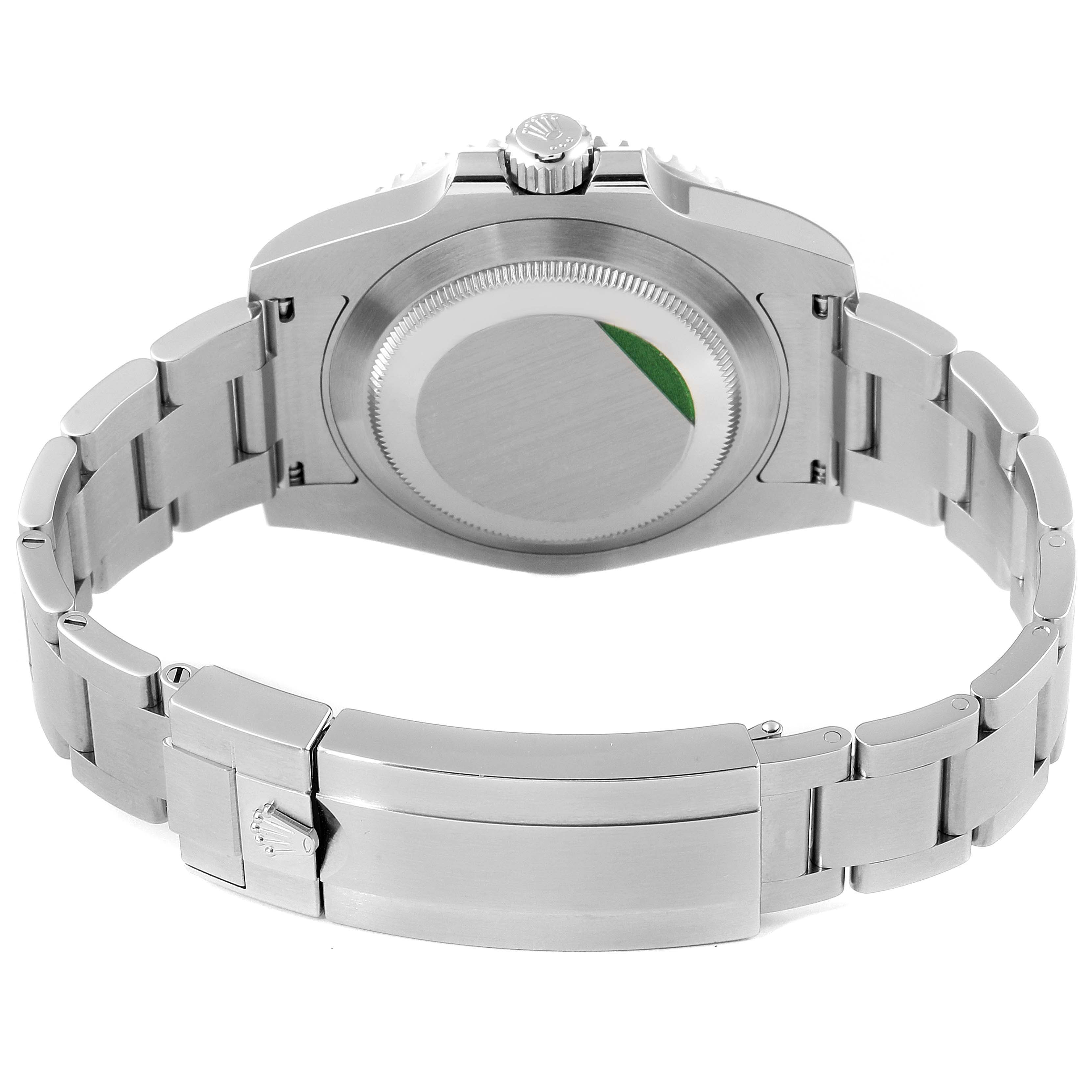 The image shows the back view of a Rolex Submariner 116610LV Men
s Stainless Steel Green Dial 116610LV Men
s Stainless Steel Green Dial watch, highlighting its case back and bracelet.