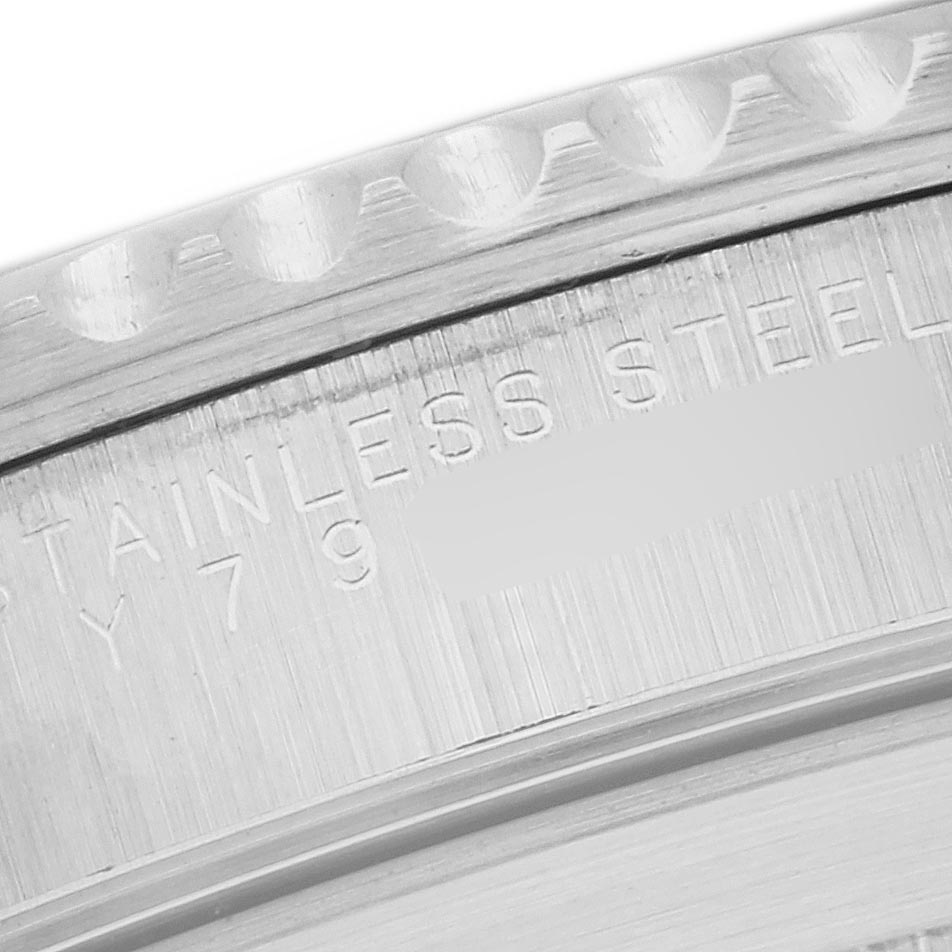 The image shows a close-up of the engraving on the stainless steel case back of a Rolex Submariner 14060 Men's Stainless Steel Black Dial 14060 Men's Stainless Steel Black Dial.