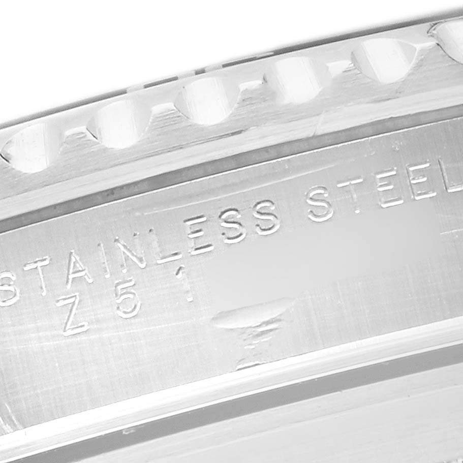 The image shows a close-up of the bezel edge and engraved text on the case side of a Rolex Submariner 14060M Men's Stainless Steel Black Dial 14060M Men's Stainless Steel Black Dial watch.