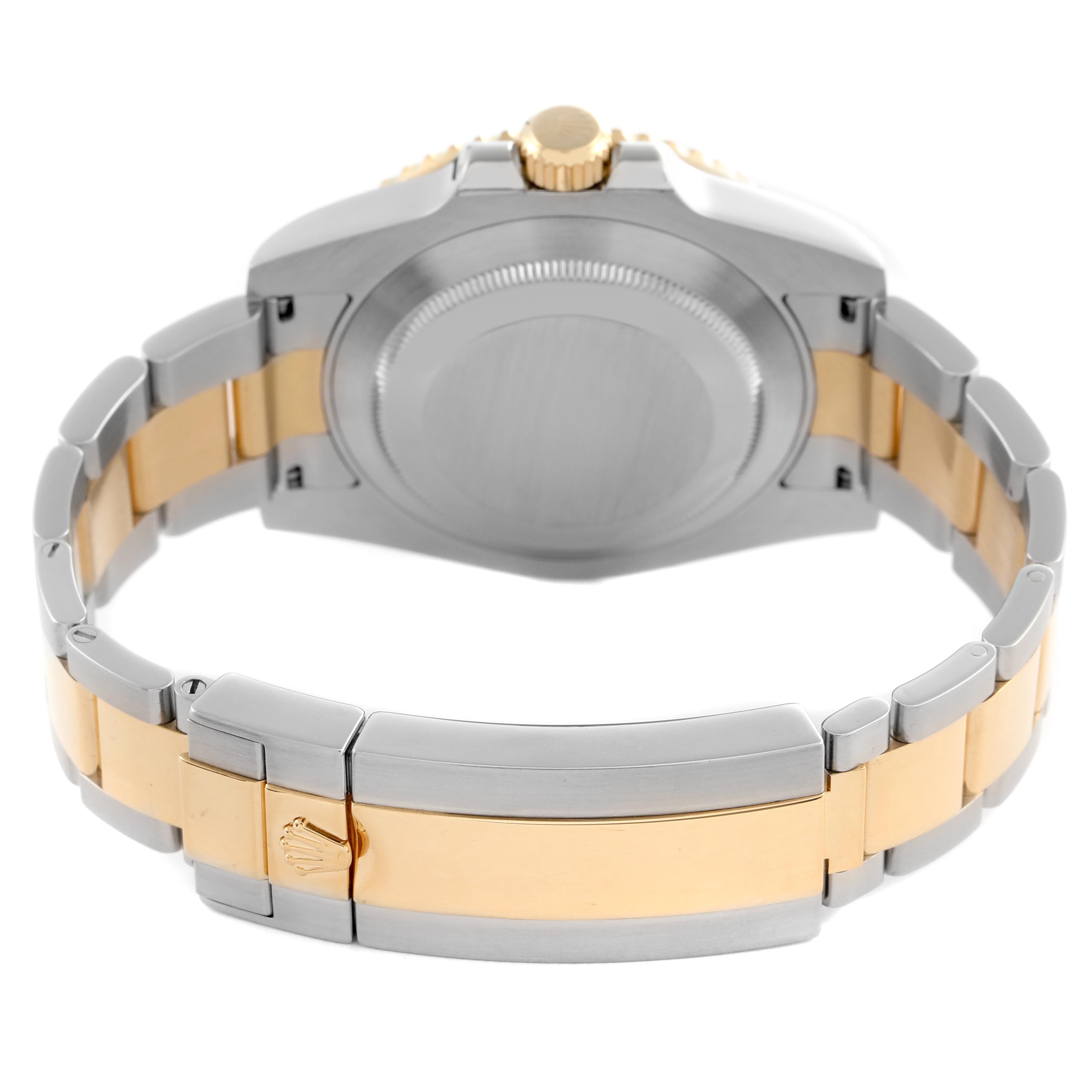 The image shows the back of a Rolex Submariner 116613 Men's Steel and Gold (two tone) Blue Dial 116613 Men's Steel and Gold (two tone) Blue Dial focusing on the clasp, bracelet, and case back.