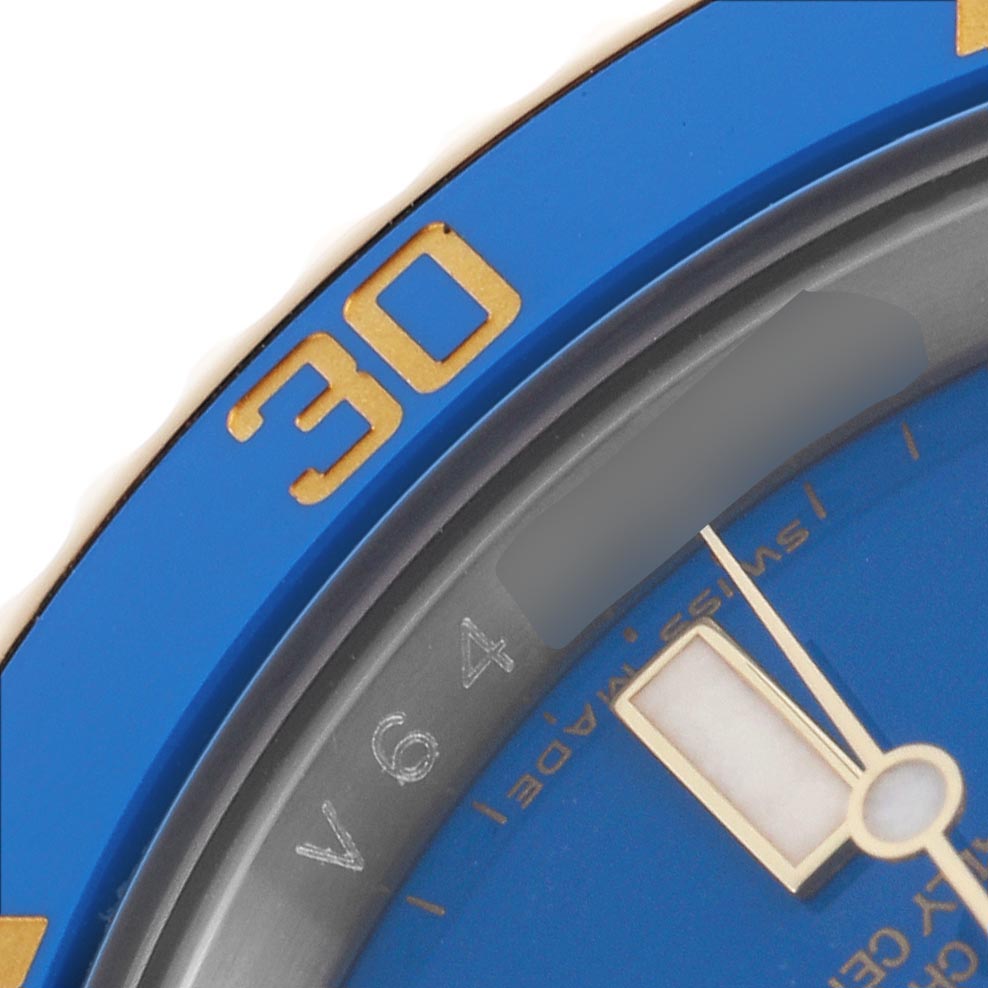 The image shows a close-up of the bezel and part of the dial of a Rolex Submariner 116613 Men's Steel and Gold (two tone) Blue Dial 116613 Men's Steel and Gold (two tone) Blue Dial, highlighting the 30-minute mark and minute hand.