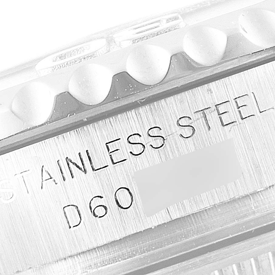 This image shows a close-up of the side of the Rolex Yacht-Master 169622 Women's Stainless Steel Silver Dial 169622 Women's Stainless Steel Silver Dial watch, highlighting its stainless steel markings and part of the bezel.