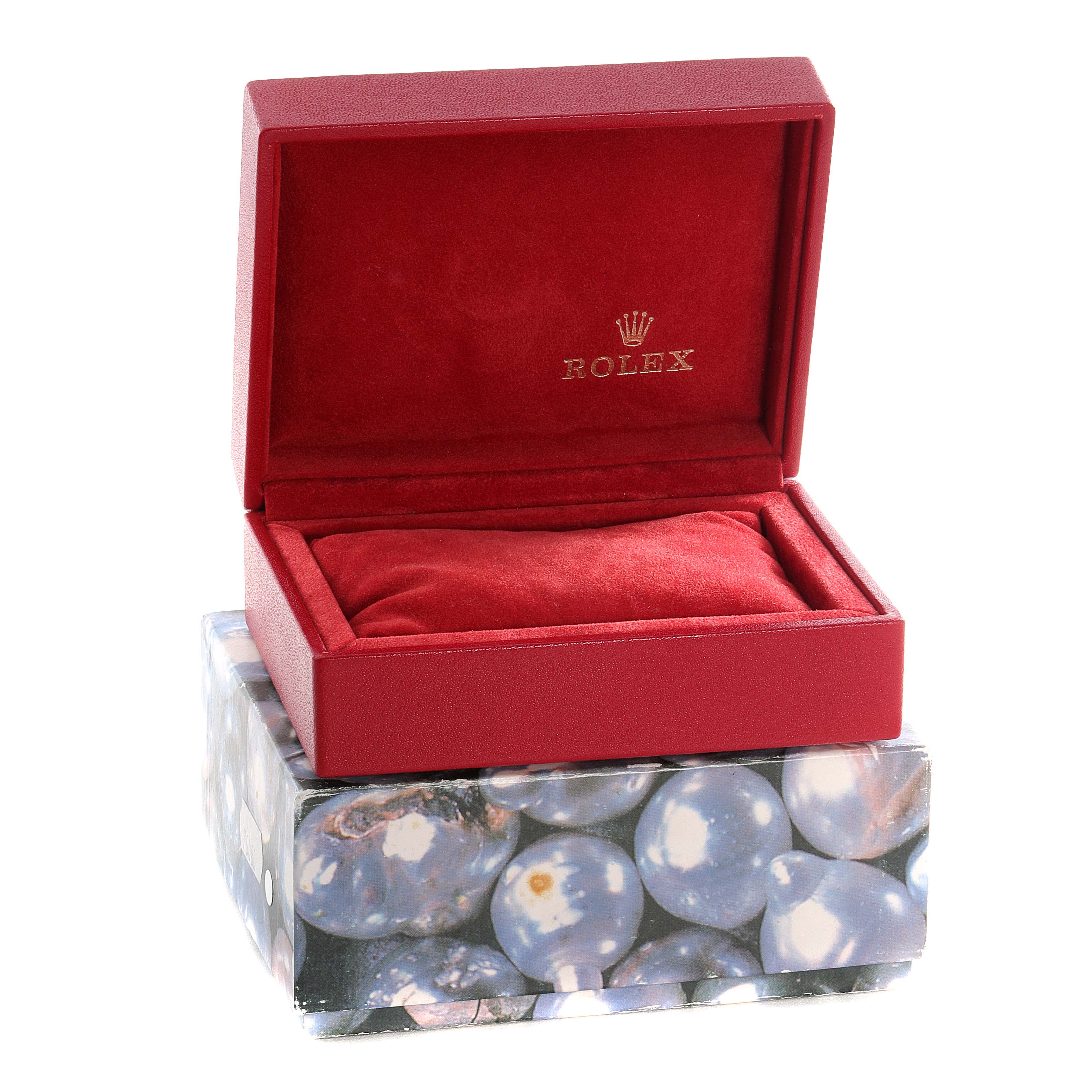 The image shows an open red watch box with a cushion, branded "Rolex," for the Yacht-Master model.