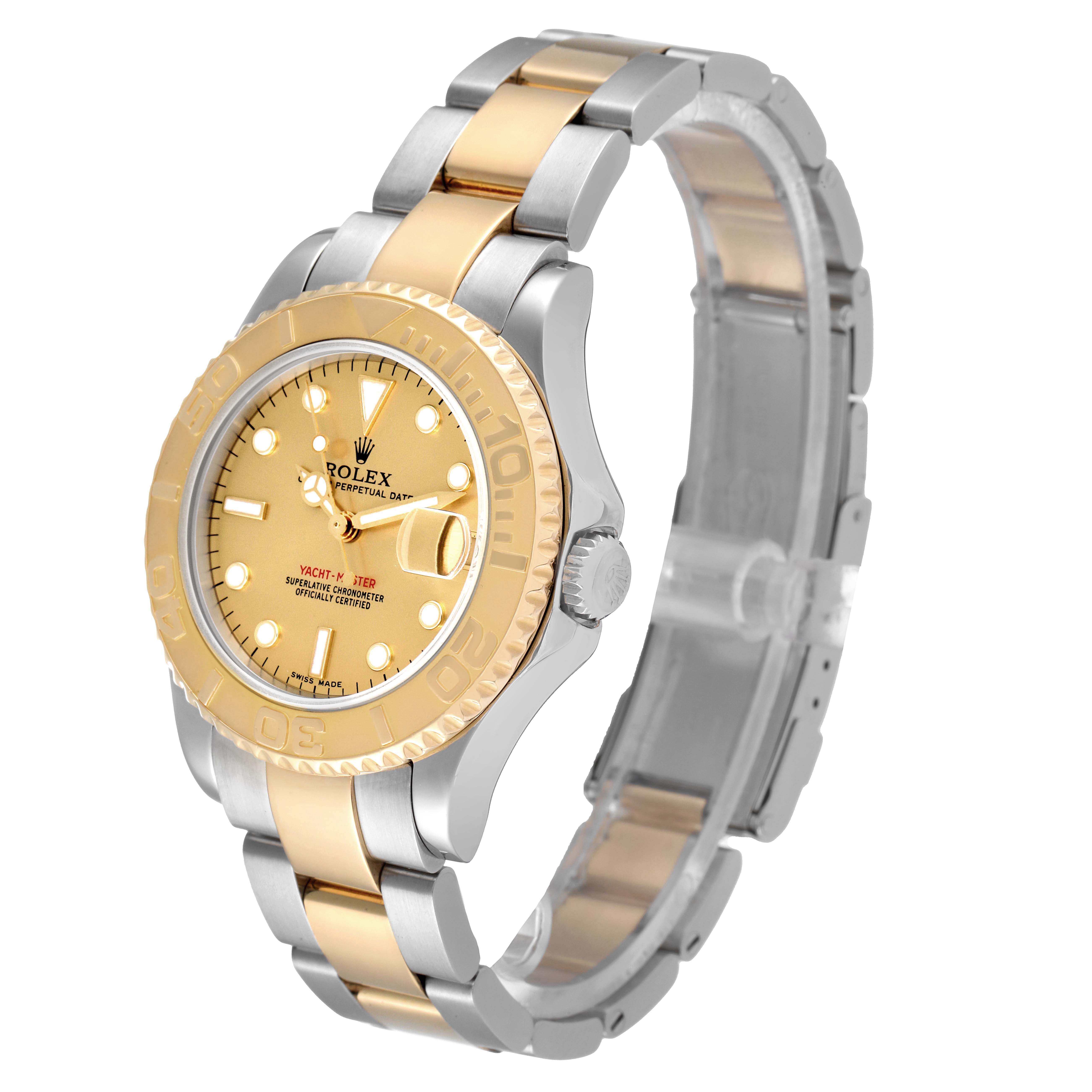 The image shows a Rolex Yacht-Master 68623 Men
s Steel and Gold (two tone) Champagne Dial 68623 Men
s Steel and Gold (two tone) Champagne Dial watch at an angle highlighting its gold and silver bracelet, bezel, and face.