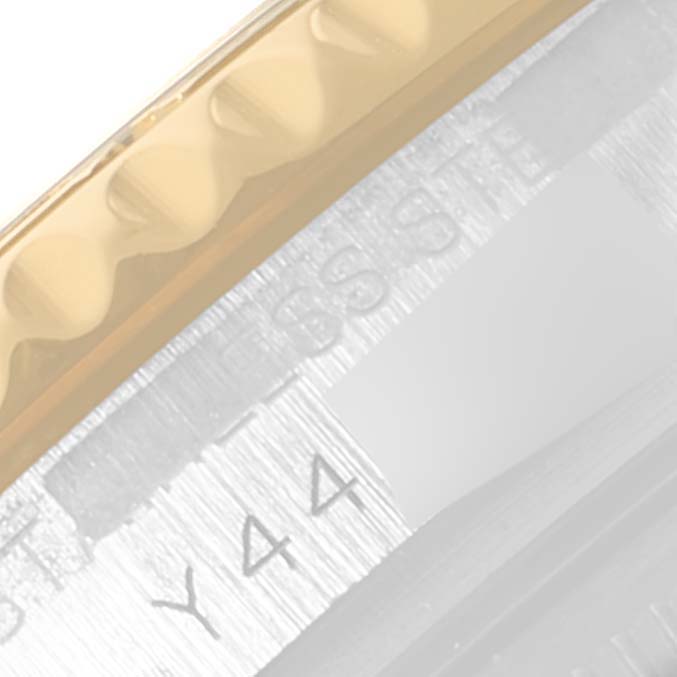 The image shows a close-up of the bezel and part of the case of a Rolex Yacht-Master 68623 Men
s Steel and Gold (two tone) Champagne Dial 68623 Men
s Steel and Gold (two tone) Champagne Dial watch.