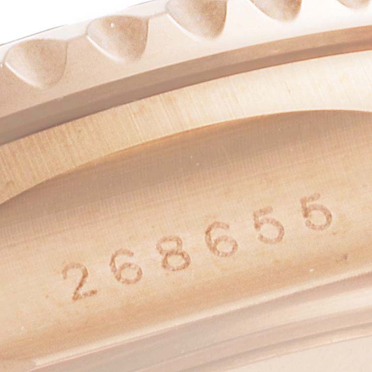 This is a close-up angle of the bezel and case side of a Rolex Yacht-Master 268655 Men's Rose Gold Black Dial 268655 Men's Rose Gold Black Dial watch, showing the engraved serial number.