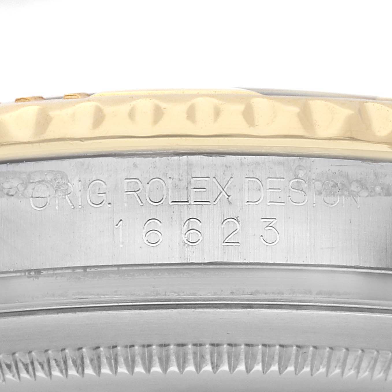 The image shows a close-up of the side of a Rolex Yacht-Master 16623 Men's Steel and Gold (two tone) Champagne Dial 16623 Men's Steel and Gold (two tone) Champagne Dial, highlighting the model number engraved on the case.