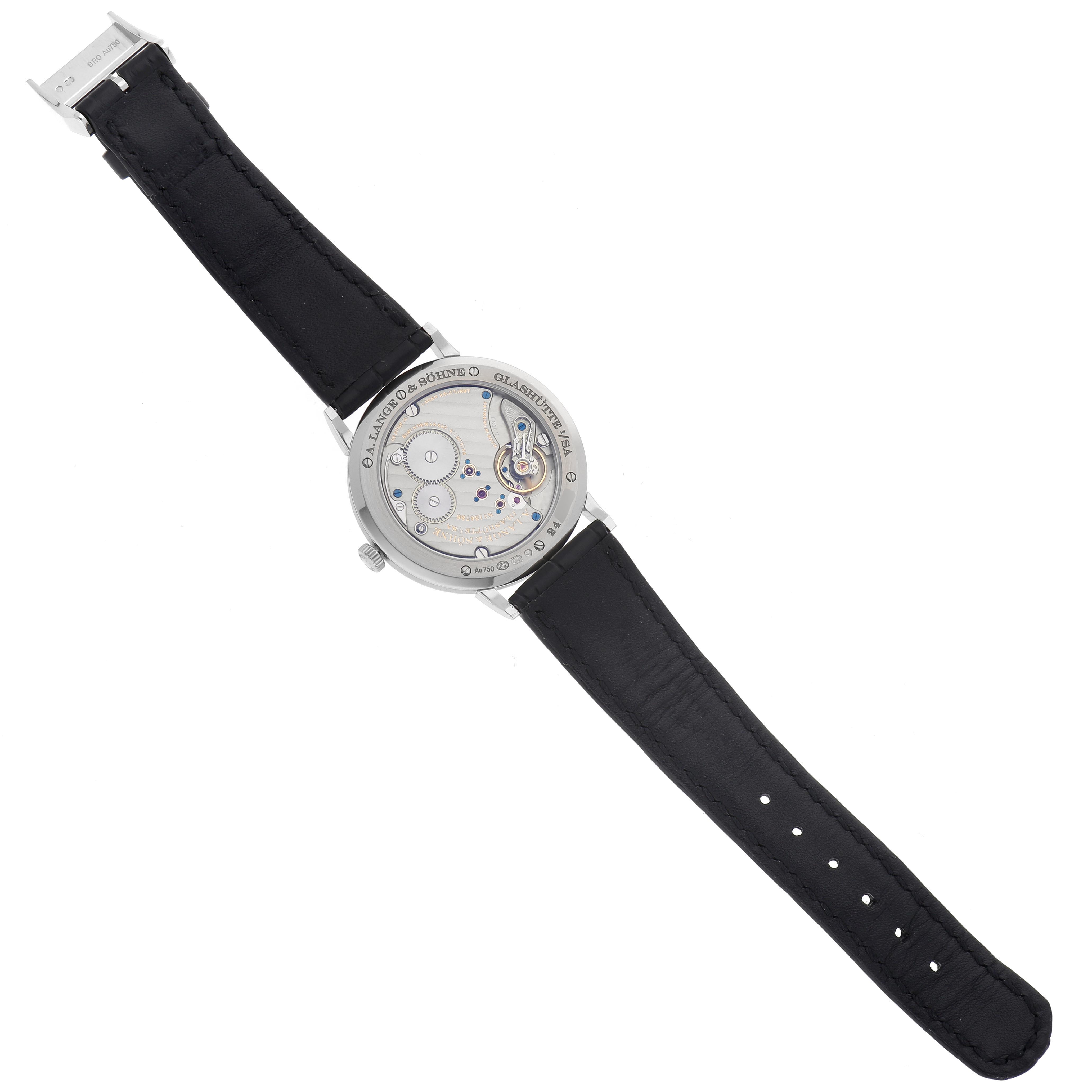 The image shows the back of the A. Lange & Sohne Saxonia 201.027/LSLS2013AM Men's White Gold Silver Dial watch with its movement and black strap visible.