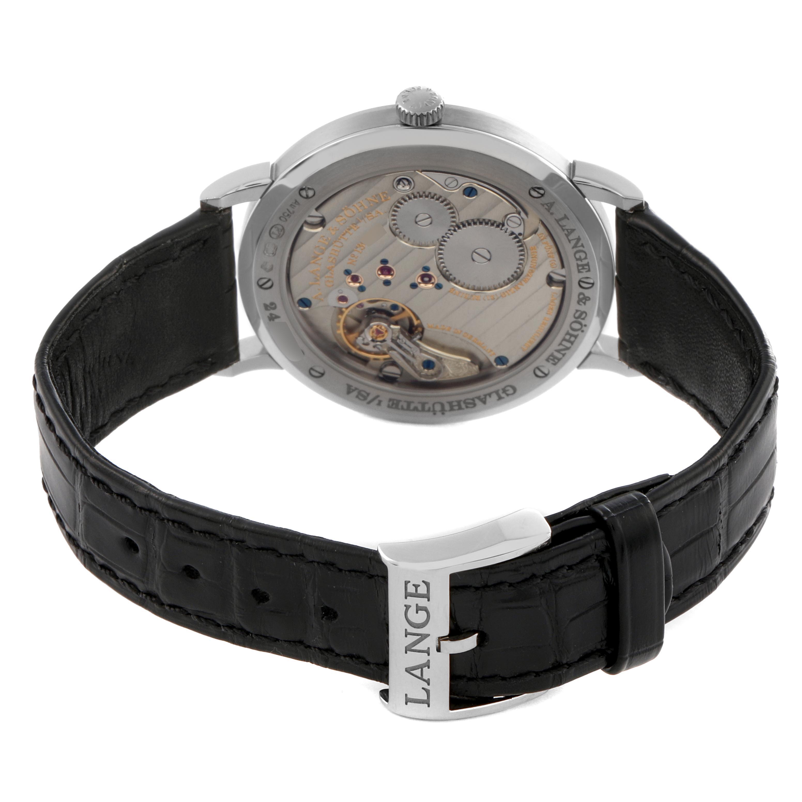 The A. Lange & Sohne Saxonia 201.027/LSLS2013AM Men's White Gold Silver Dial watch is shown from the back, displaying the intricate movement and leather strap.