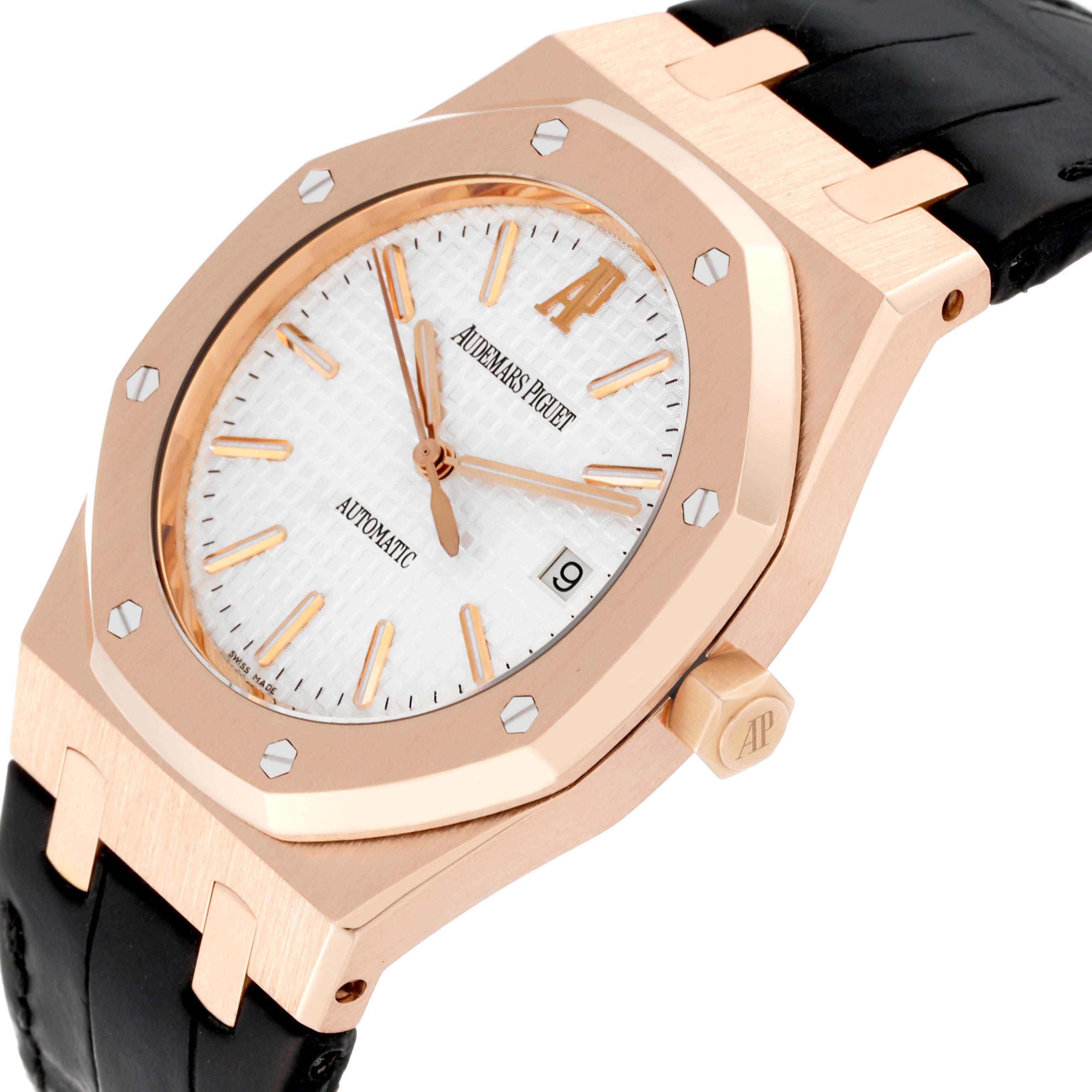 The Audemars Piguet Royal Oak 15300OR.OO.D088CR.02 Men's Rose Gold Silver Dial 15300OR.OO.D088CR.02 Men's Rose Gold Silver Dial watch is shown at an angle, highlighting its octagonal bezel, white dial, date window, and black strap.
