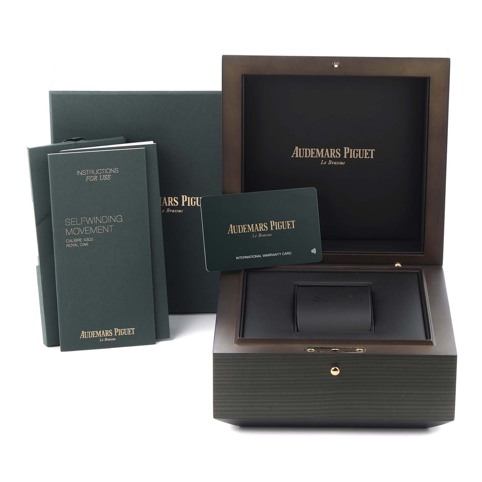 The image shows the packaging and accessories of the Audemars Piguet Royal Oak 15500ST.OO.1220ST.01 Men's Stainless Steel Blue Dial 15500ST.OO.1220ST.01 Men's Stainless Steel Blue Dial, including a box, warranty card, and manuals.