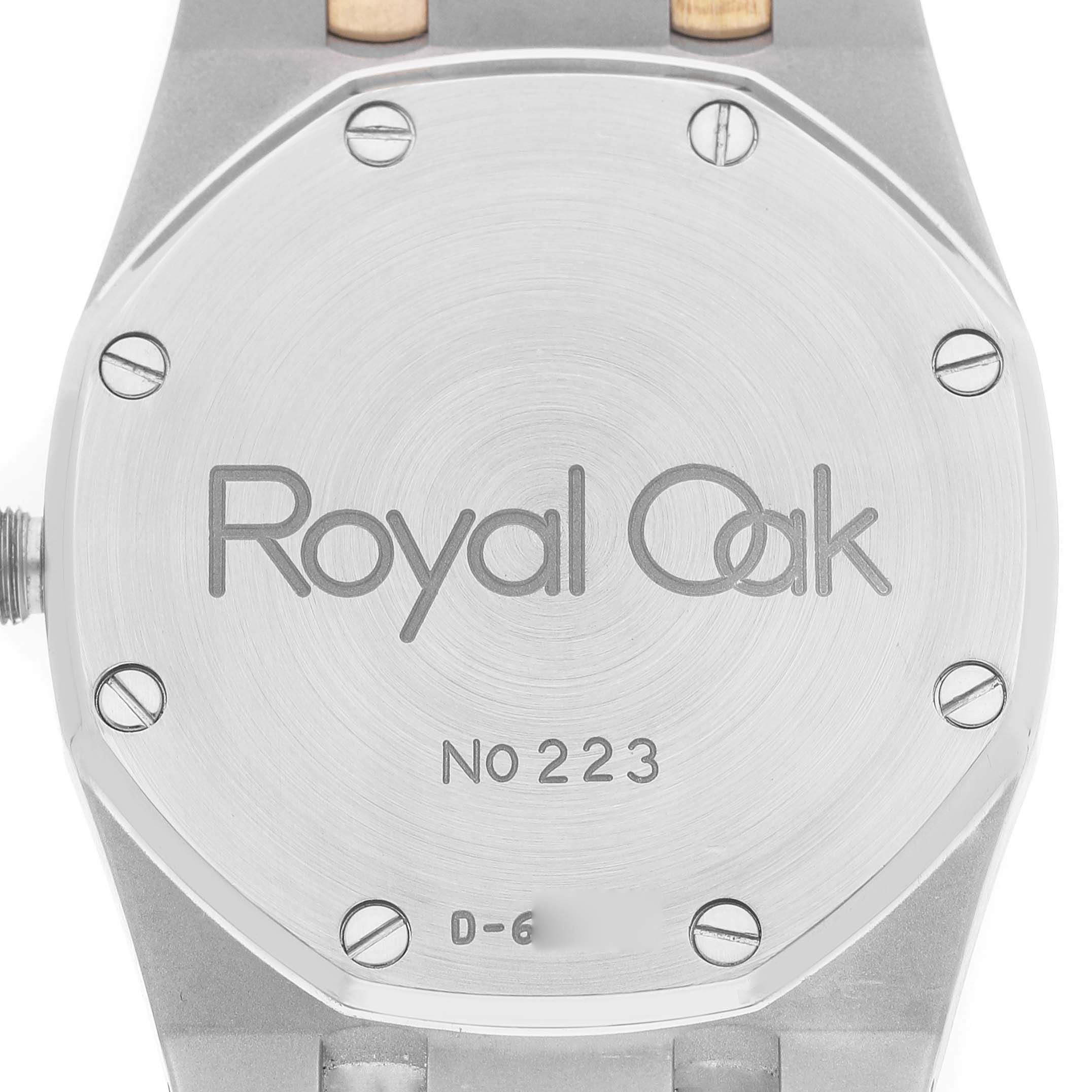 The image shows the back case of an Audemars Piguet Royal Oak 15000SA Men's Steel and Gold (two tone) Grey Dial watch, displaying the model name, number, and screws.