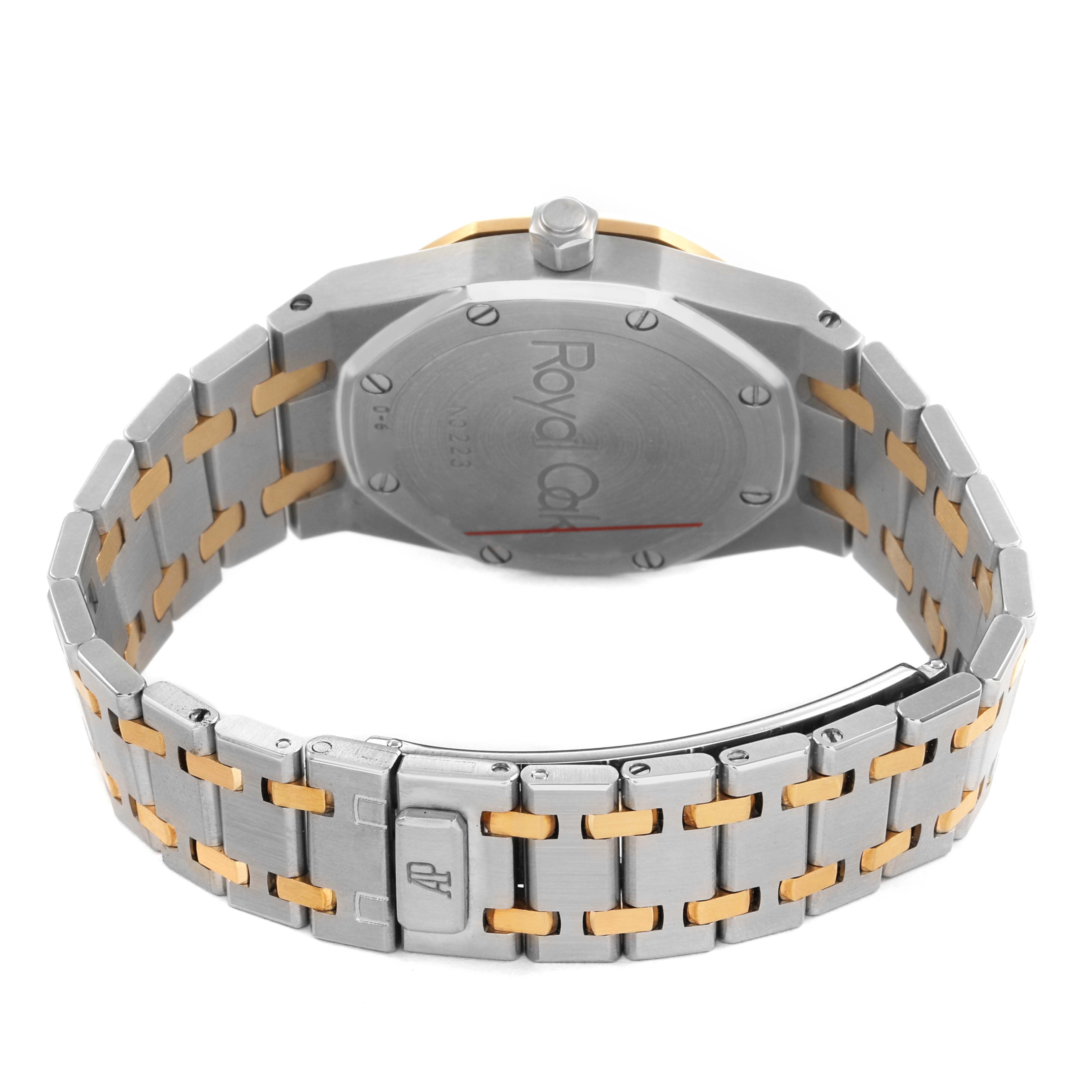 The image shows the back of an Audemars Piguet Royal Oak 15000SA Men's Steel and Gold (two tone) Grey Dial watch, highlighting the case back and the bracelet.