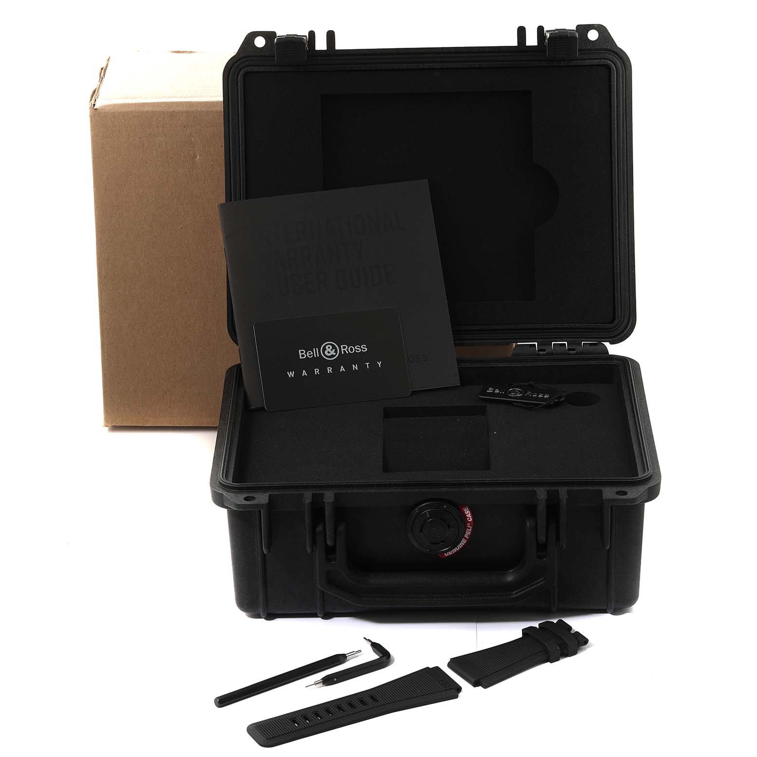 The image shows the accessories and packaging of a Bell 
Ross Instruments BR0392-D-WH-BR/SCA Men
s Bronze Silver Dial BR0392-D-WH-BR/SCA Men
s Bronze Silver Dial model watch, including a case, straps, and tools.