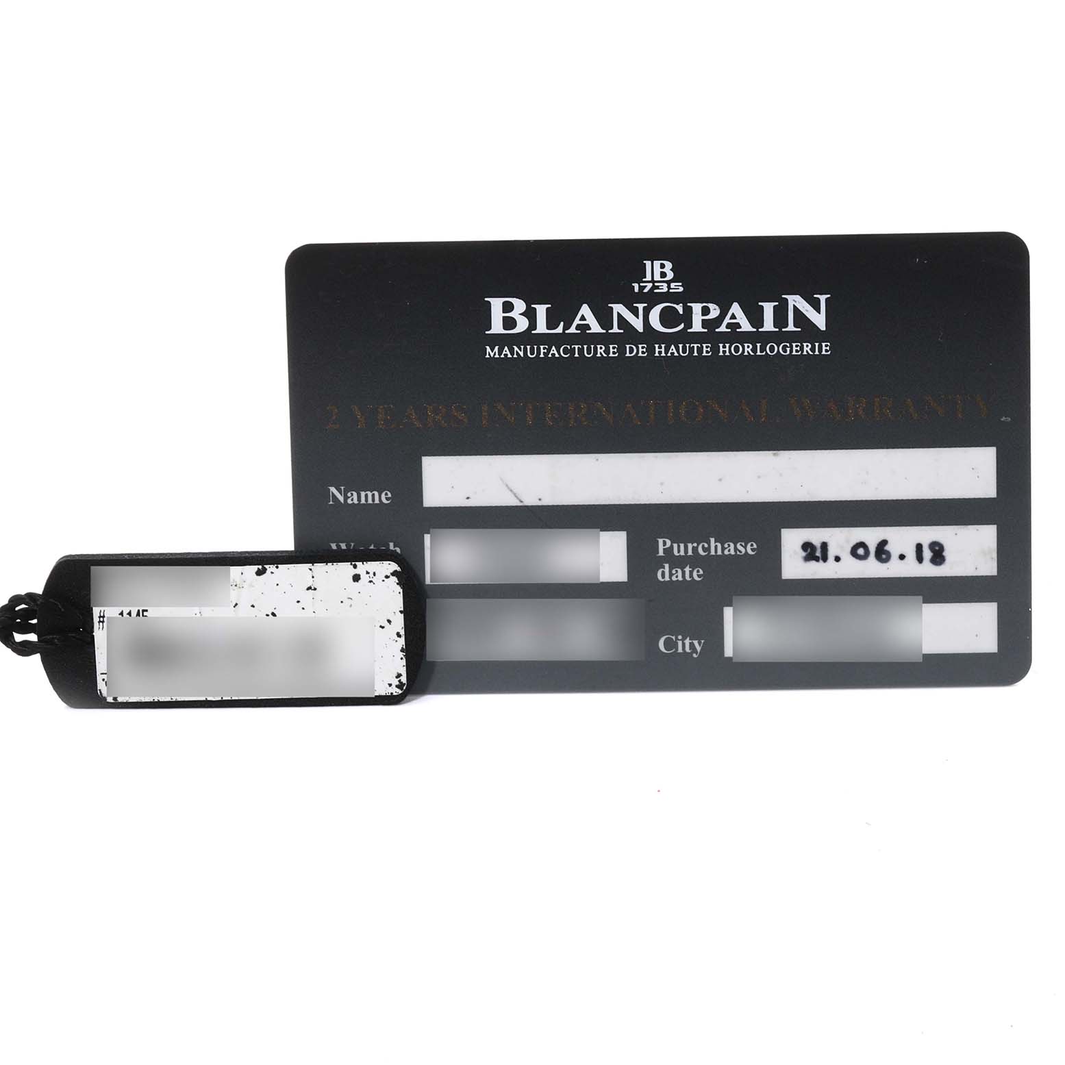 This image shows the warranty card and sales tag for a Blancpain Fifty Fathoms 5066F-1140-52A Men's Stainless Steel Blue Dial 5066F-1140-52A Men's Stainless Steel Blue Dial watch.