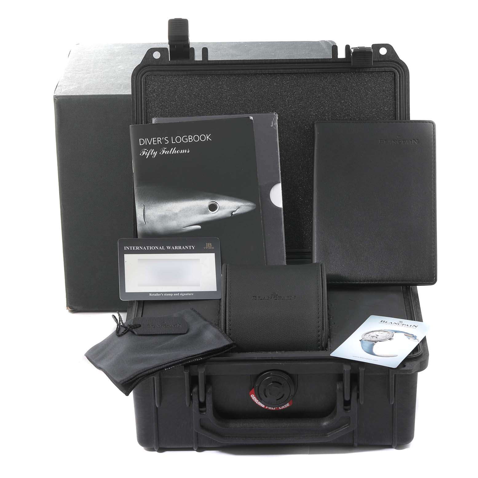 This image shows an open case revealing the accessories for the Blancpain Fifty Fathoms 5066F-1140-52A Men's Stainless Steel Blue Dial 5066F-1140-52A Men's Stainless Steel Blue Dial watch, including a logbook, warranty card, and pouch.