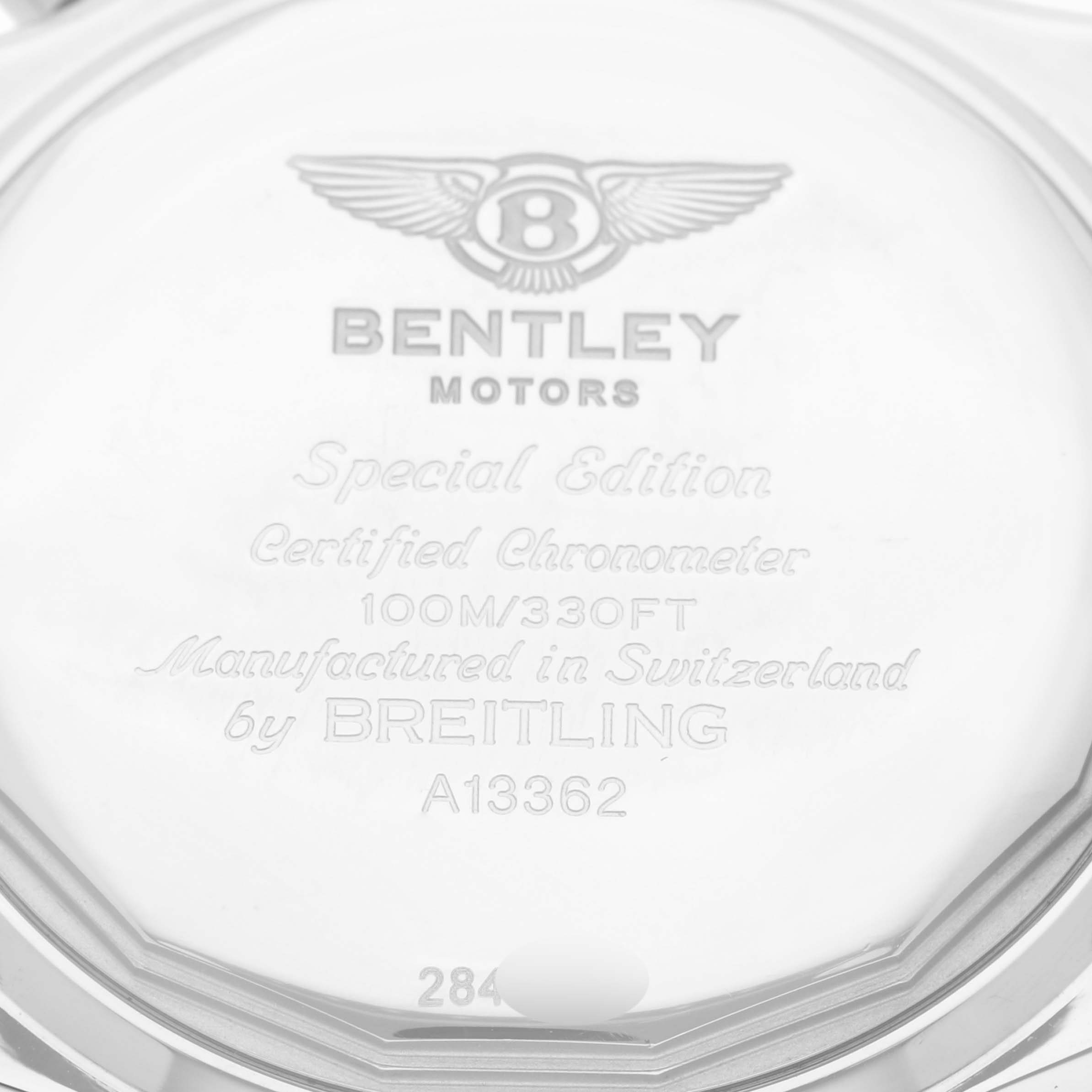 This image shows the back case of a Bentley model watch by Breitling, displaying engravings and model information.