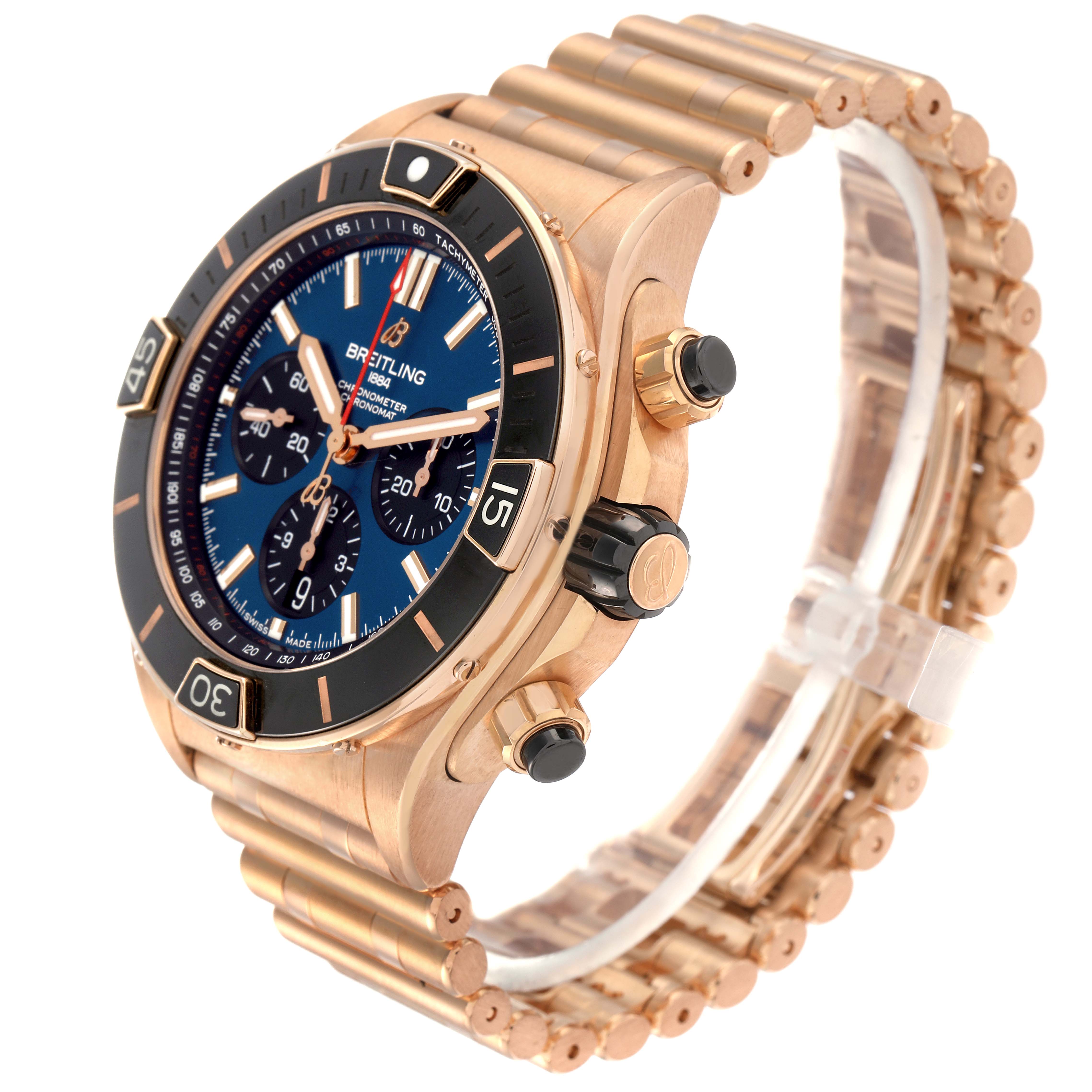 The Breitling Chronomat RB0136 Men's Rose Gold Blue Dial RB0136 Men's Rose Gold Blue Dial watch is shown at an angle displaying the dial, bezel, pushers, crown, and part of the bracelet.