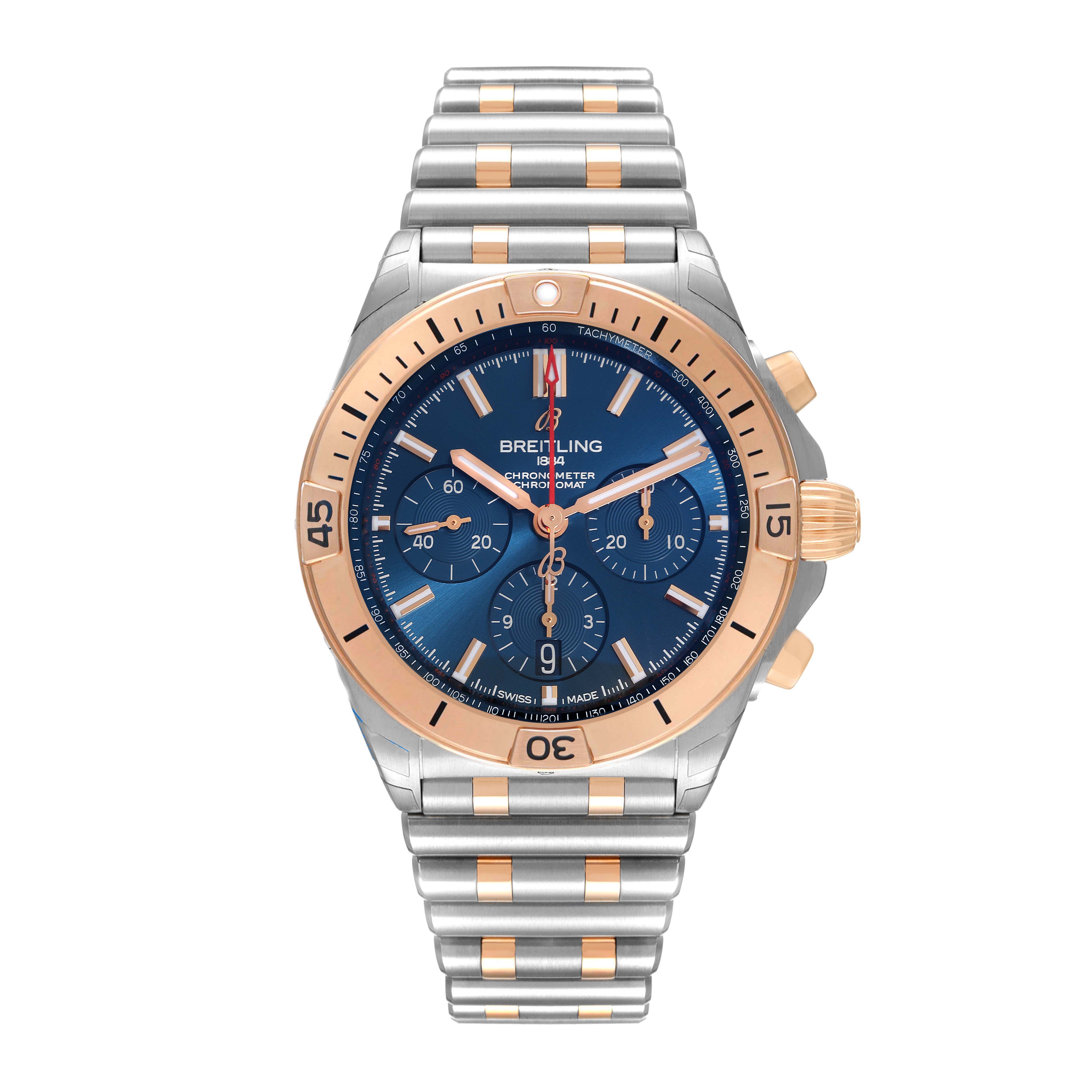 The Breitling Chronomat UB0134101C1U1 Men's Steel and Gold (two tone) Blue Dial UB0134101C1U1 Men's Steel and Gold (two tone) Blue Dial watch is shown from a front angle, displaying the blue dial, chronograph subdials, and metal bracelet.