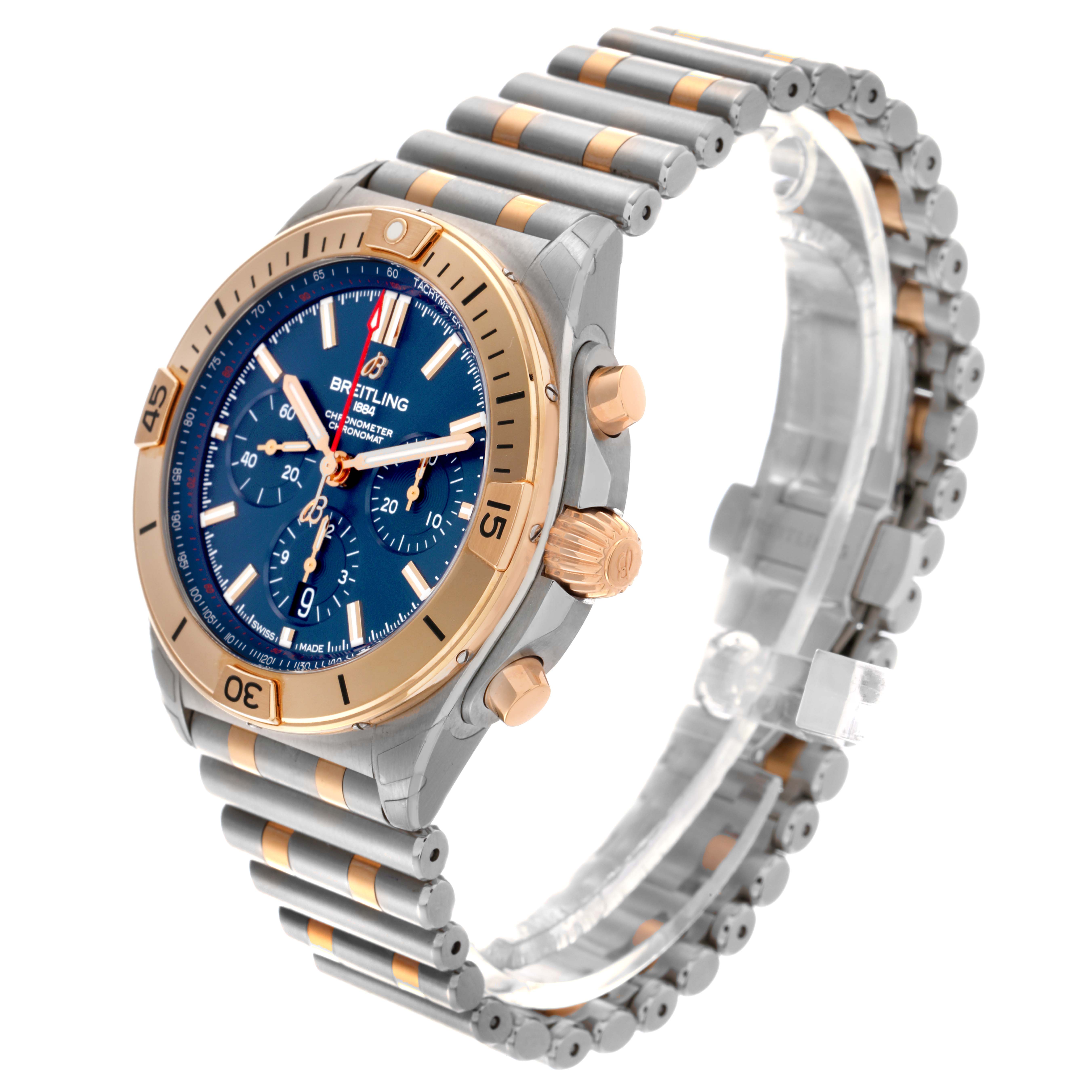 The Breitling Chronomat UB0134101C1U1 Men's Steel and Gold (two tone) Blue Dial UB0134101C1U1 Men's Steel and Gold (two tone) Blue Dial watch is shown at an angled side view, highlighting the bezel, dial, crown, and unique bracelet design.