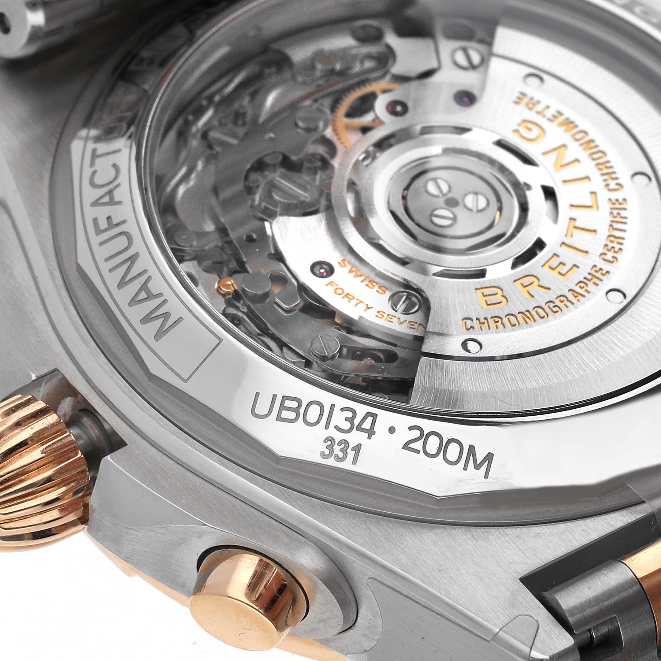 The image shows the back of a Breitling Chronomat UB0134101C1U1 Men's Steel and Gold (two tone) Blue Dial UB0134101C1U1 Men's Steel and Gold (two tone) Blue Dial watch, highlighting the movement and case-back details.