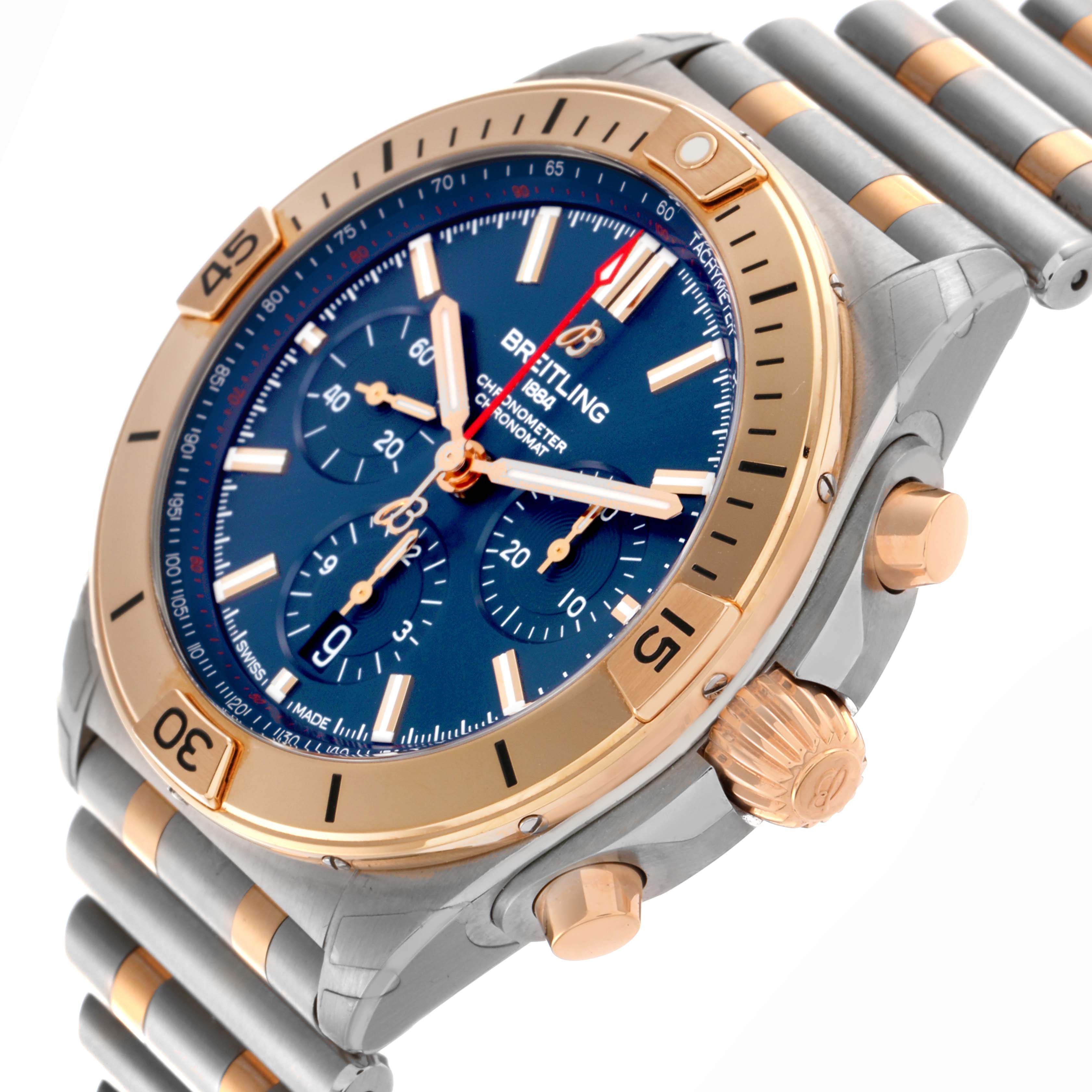 The image shows a Breitling Chronomat UB0134101C1U1 Men's Steel and Gold (two tone) Blue Dial UB0134101C1U1 Men's Steel and Gold (two tone) Blue Dial watch at an angled view highlighting the dial, bezel, chronograph subdials, crown, and bracelet.