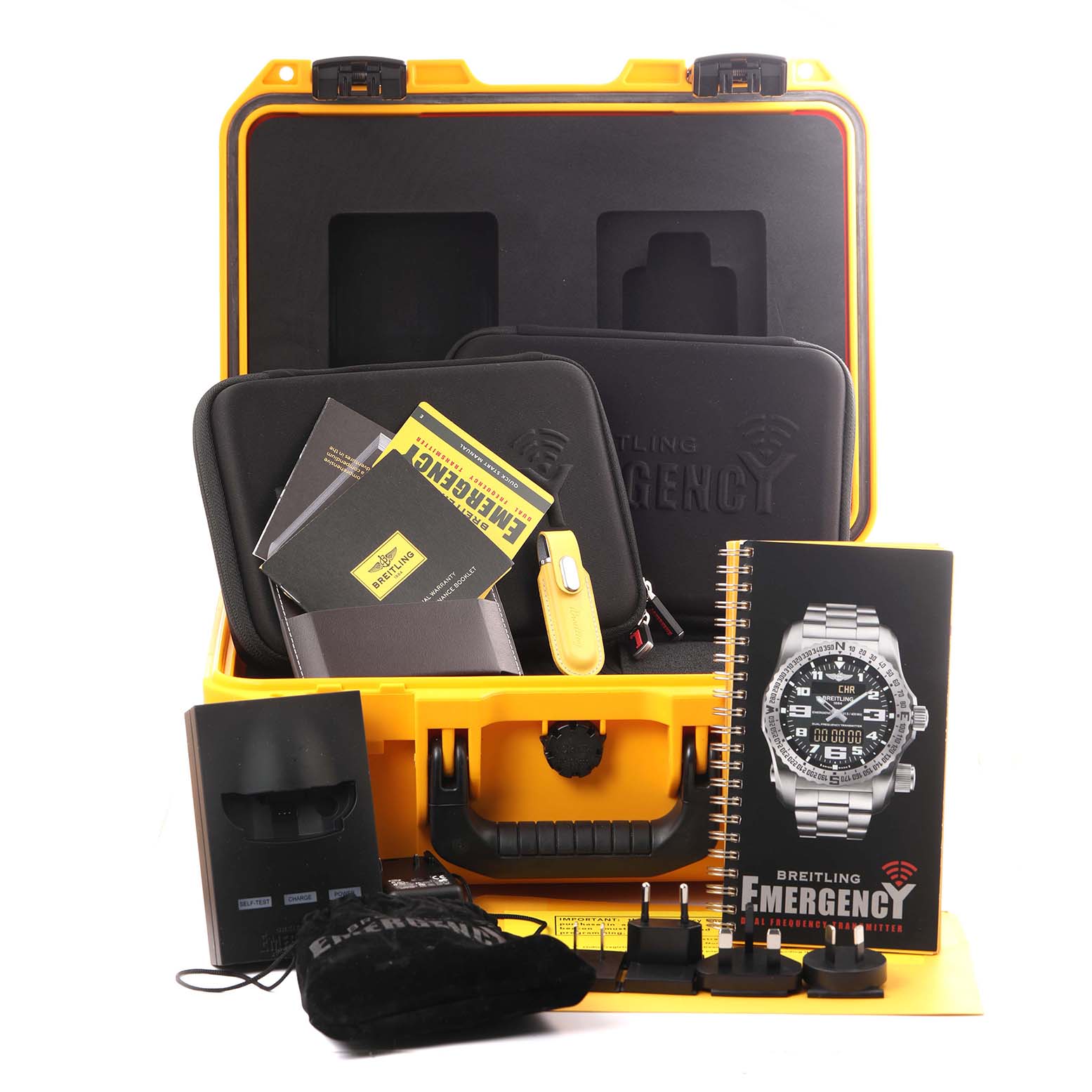 The image shows a yellow case with accessories, manuals, and a display featuring the Breitling Professional Series E76325 Men's Titanium Orange Dial E76325 Men's Titanium Orange Dial watch.