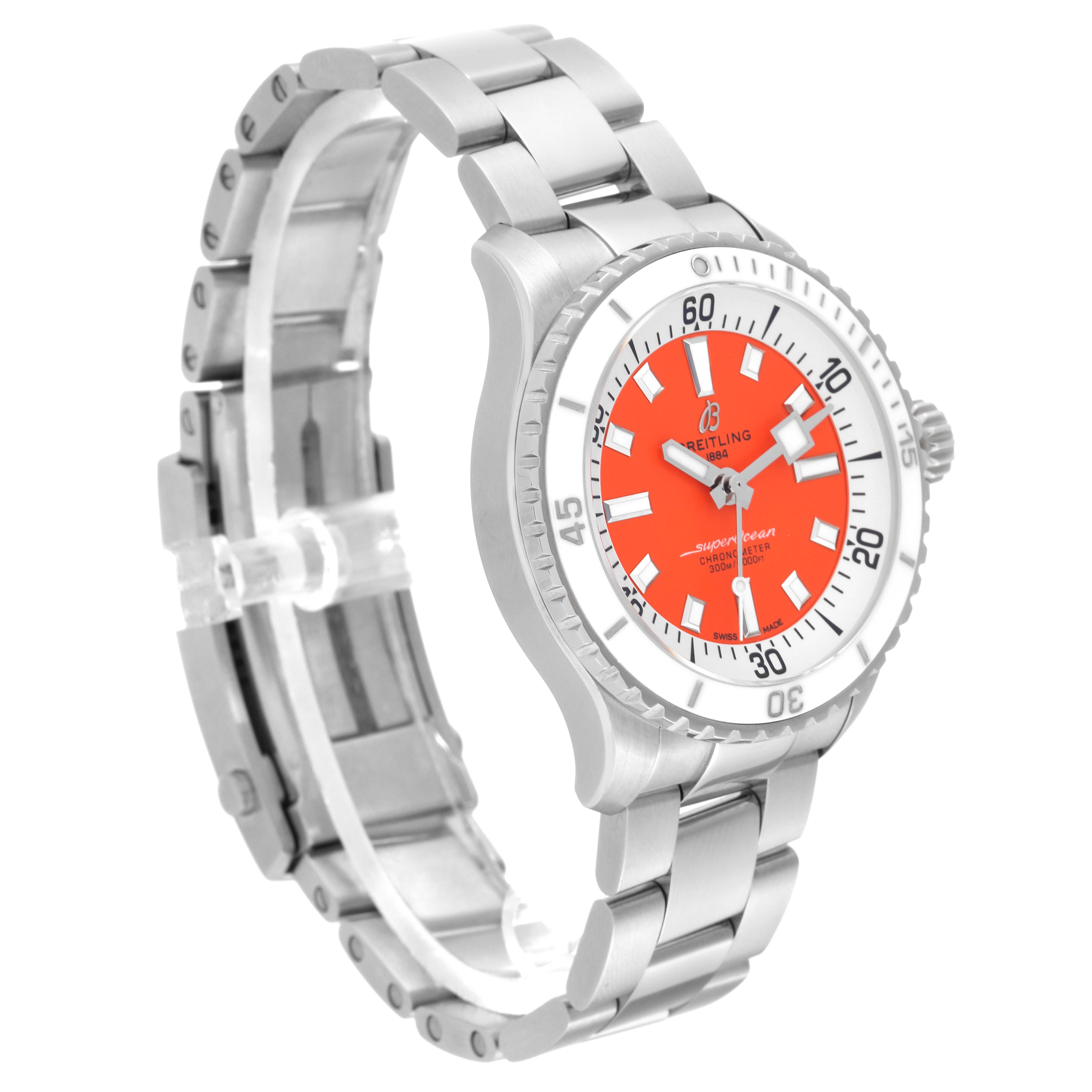 The Breitling A17377 Women's Stainless Steel Orange Dial A17377 Women's Stainless Steel Orange Dial Superocean 36 A17377 Ladies Watch is shown from an angled side view, displaying the orange dial, steel bracelet, and bezel.