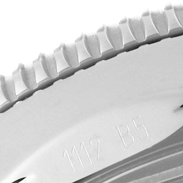 The image shows a close-up of the bezel and part of the engraving on a Breitling Superocean A17321 Men
s Stainless Steel Silver Dial A17321 Men
s Stainless Steel Silver Dial model watch.
